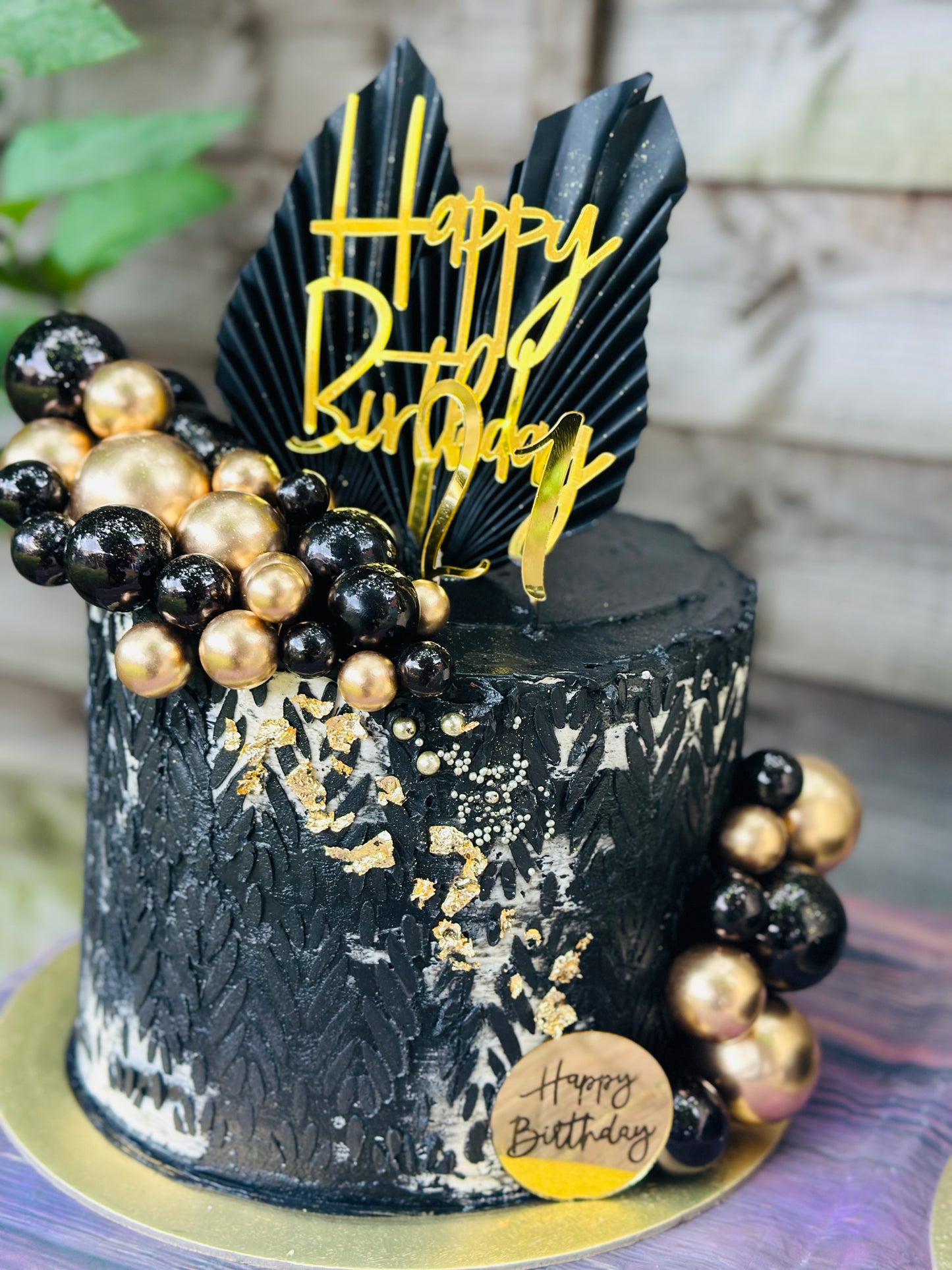 Elegant Black Birthday Cake with Gold Decor – Custom Orders in East London