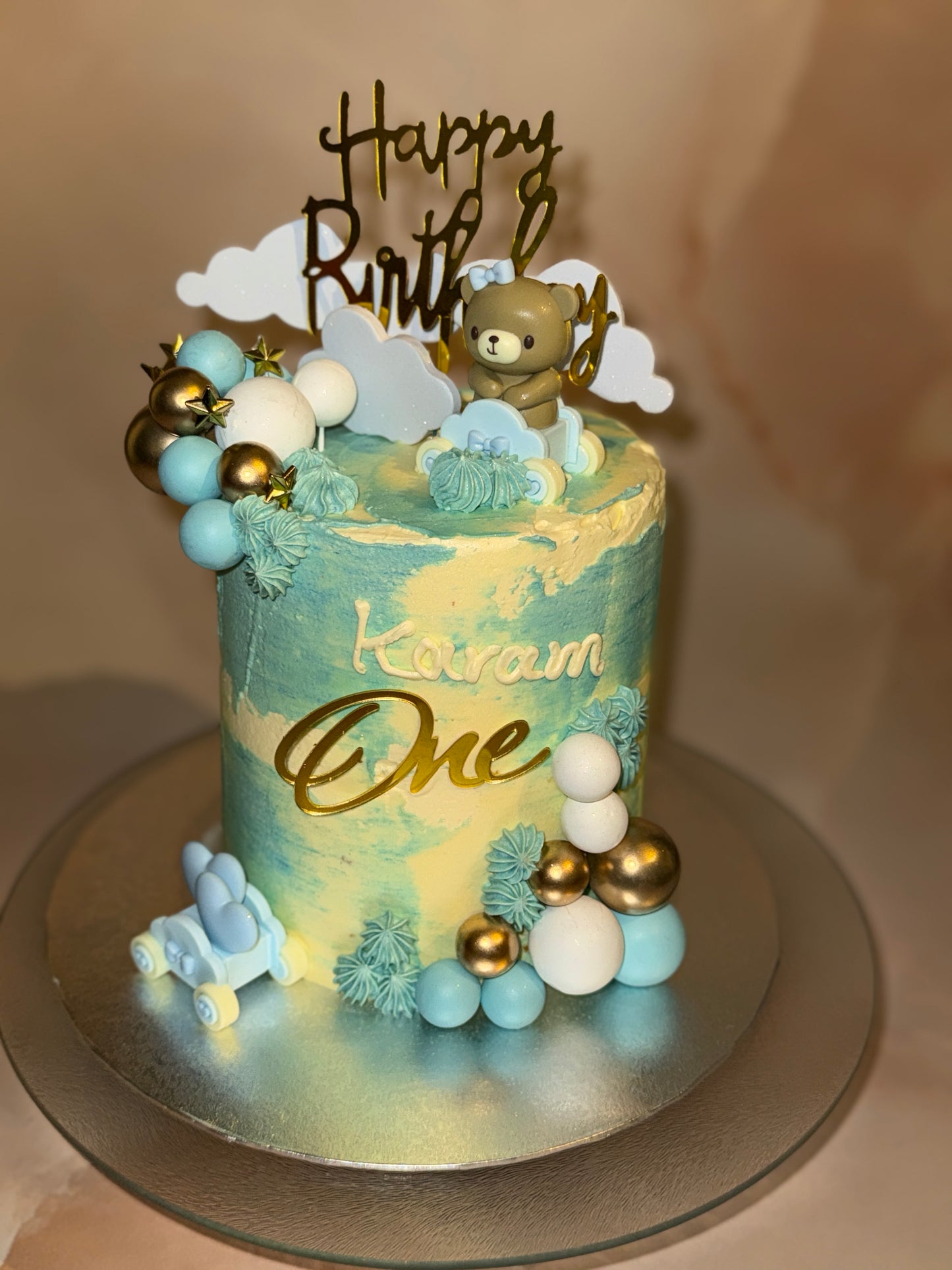 Custom 1st birthday cake for baby boy with teddy bear in Romford