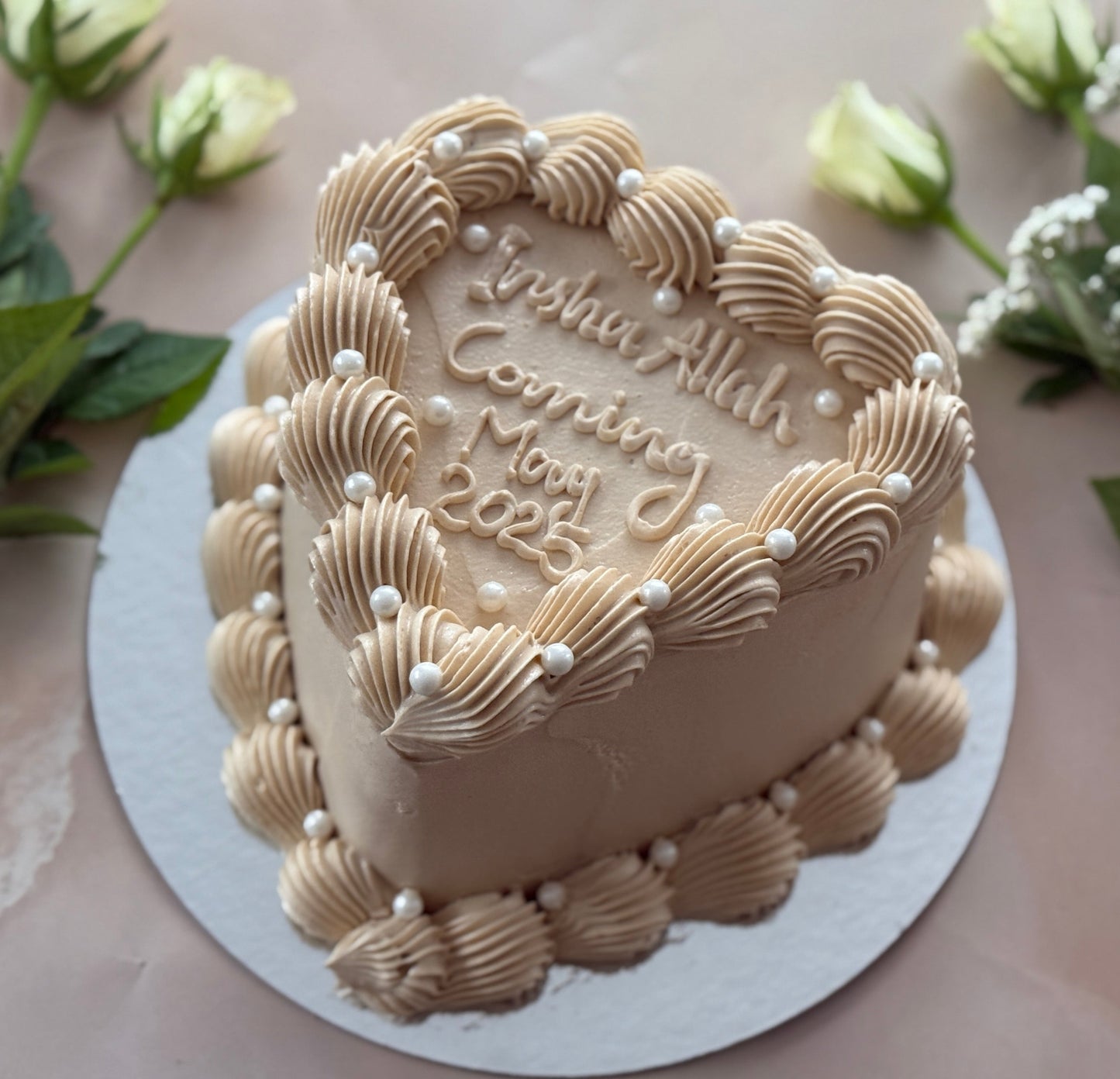 Neutral beige buttercream heart cake with pearl accents delivered to E3 Bow and RM3 Harold Wood