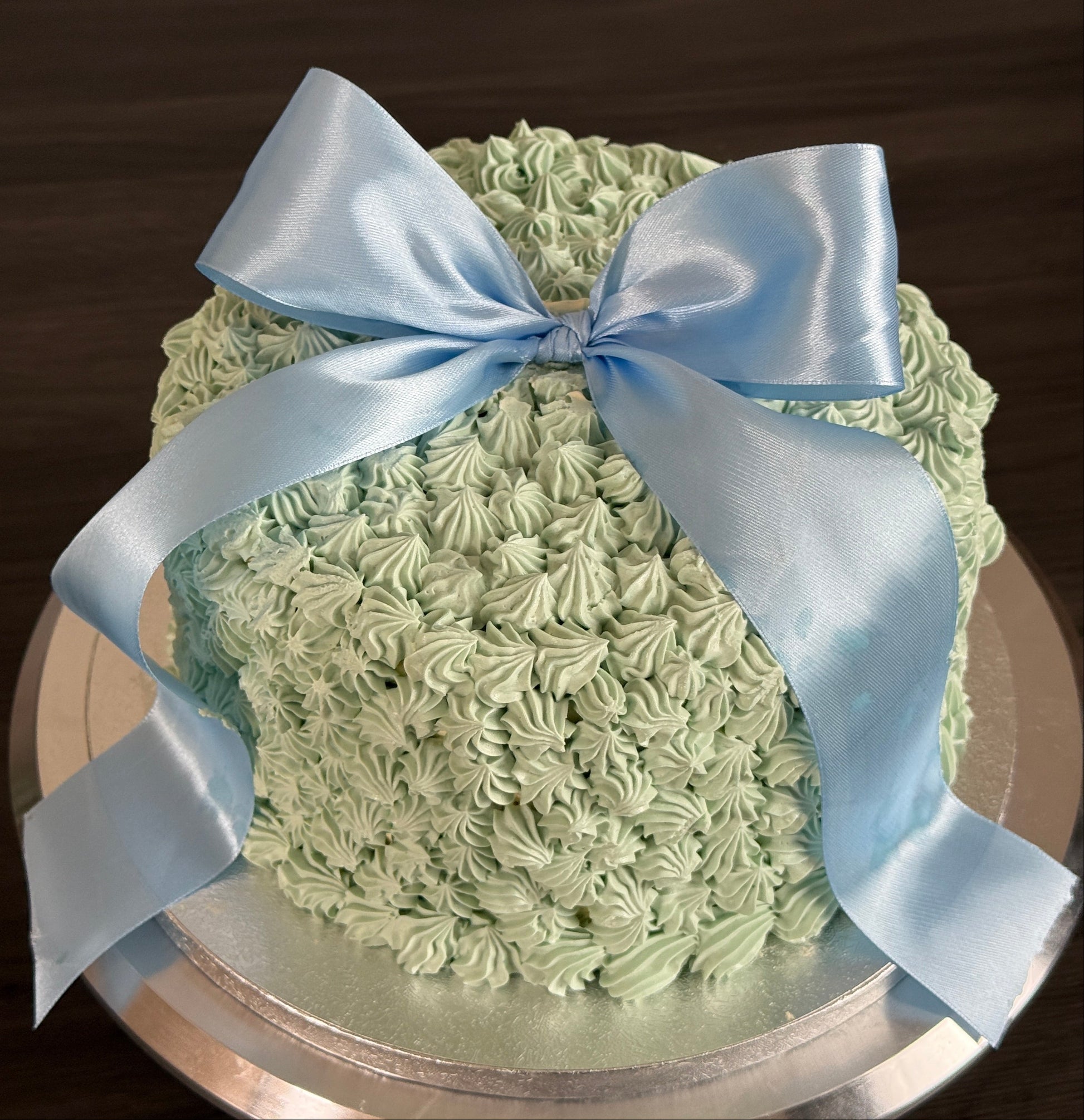 Big Bow Celebration Cake with blue satin ribbon – birthday cake delivery in East London and Romford.