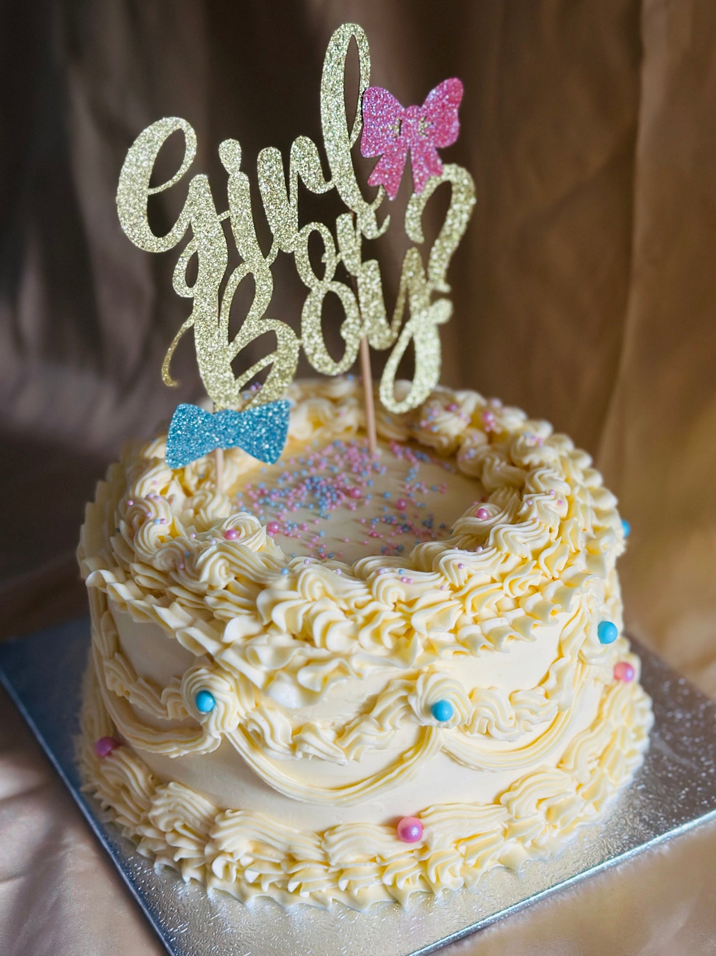 Custom buttercream gender reveal cake for baby shower in East London