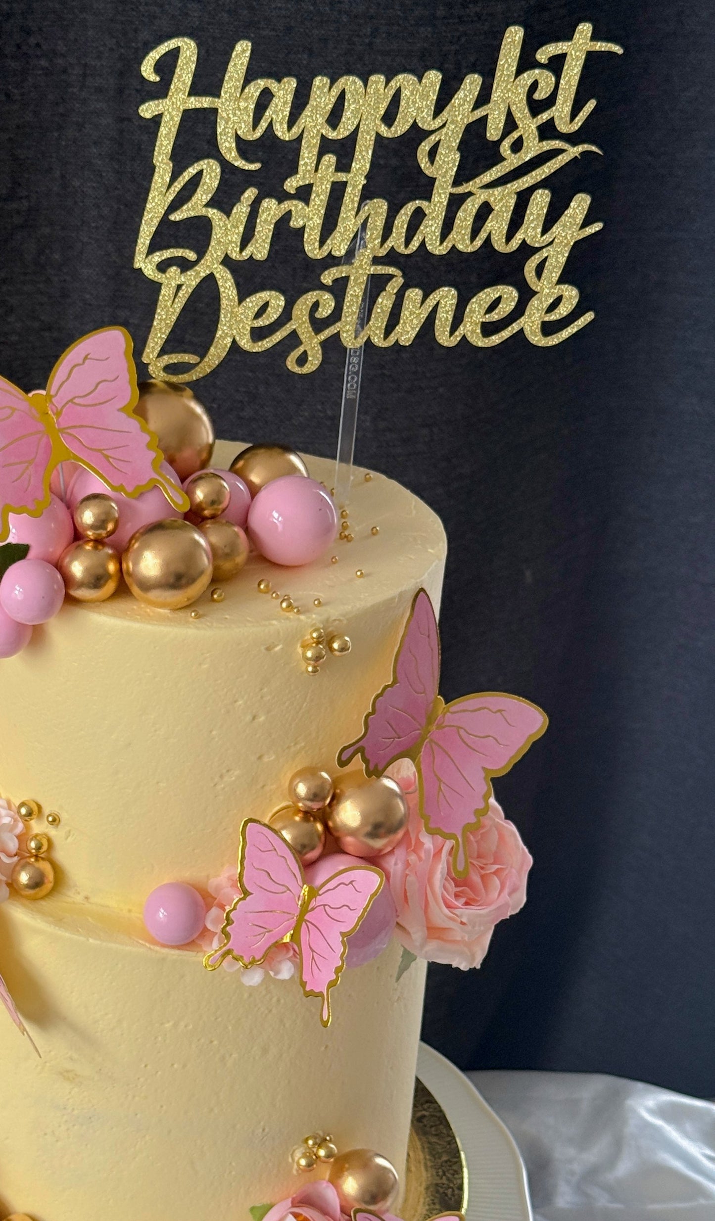 Close up of butterflies and blossom on first birthday cake, custom cakes East London, Romford and Ilford.
