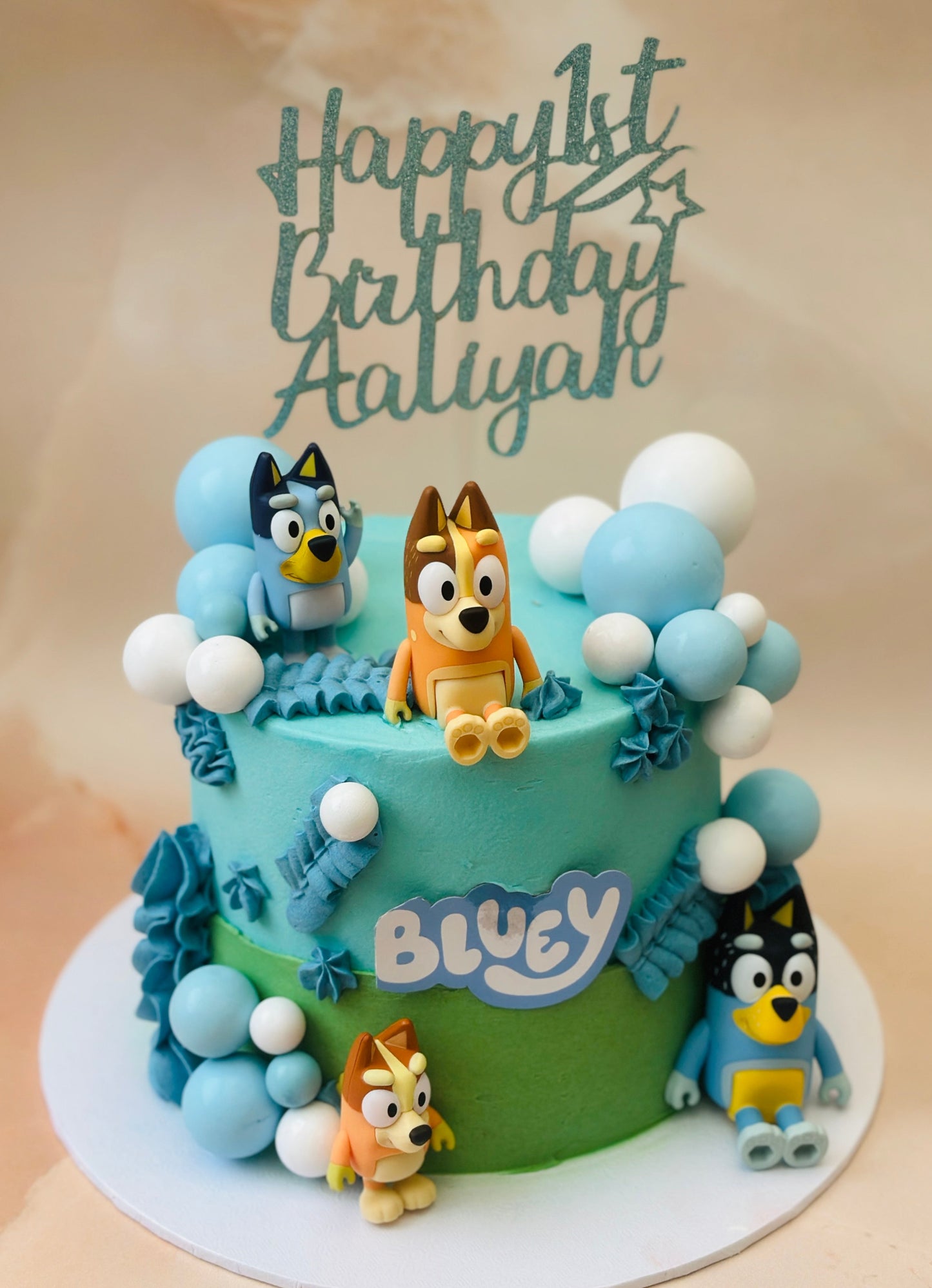 Buy Bluey birthday cake in Romford and Ilford – custom children’s cake with Bluey characters and decorations.