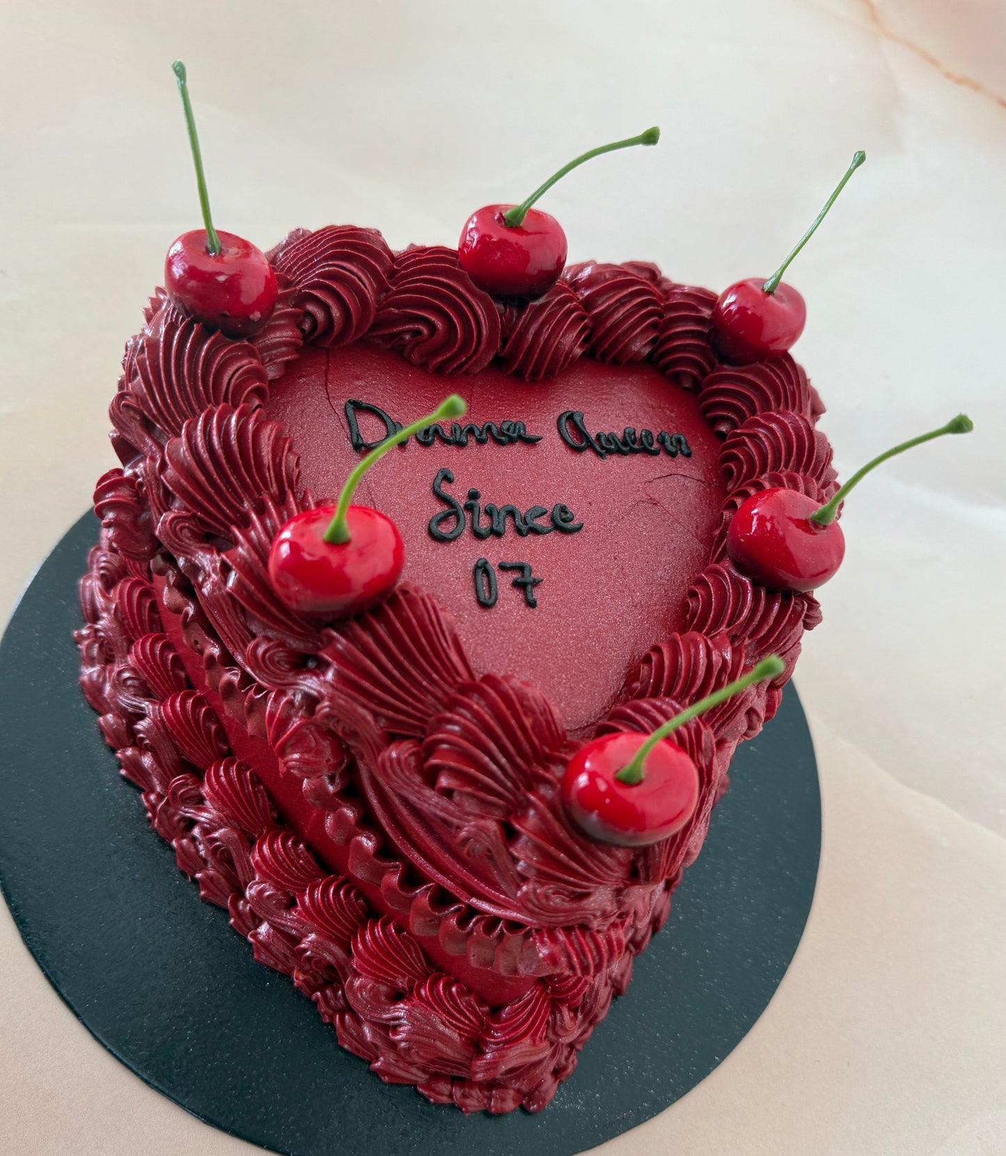 Custom cherry-topped heart cake for delivery in RM7 Rush Green and IG2 Gants Hill