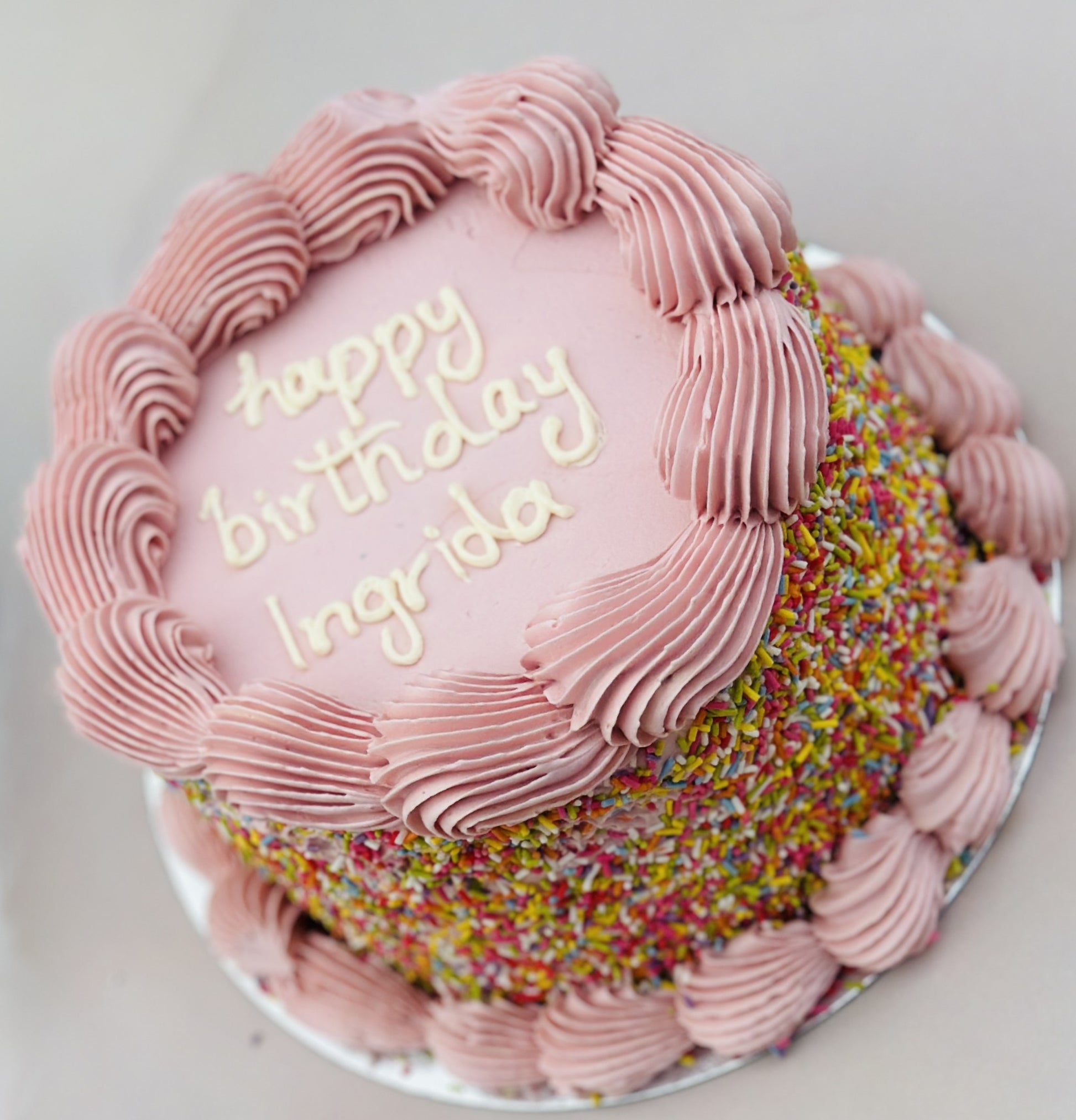 Funfetti sprinkle cake with rainbow toppings, available for birthday delivery across Dagenham and East London.