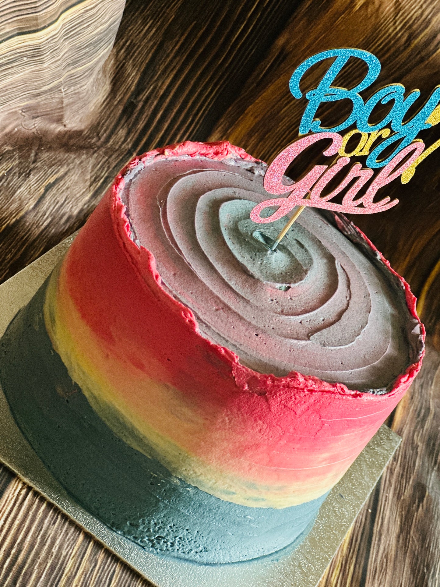 colourful gender reveal cake for baby shower in East London