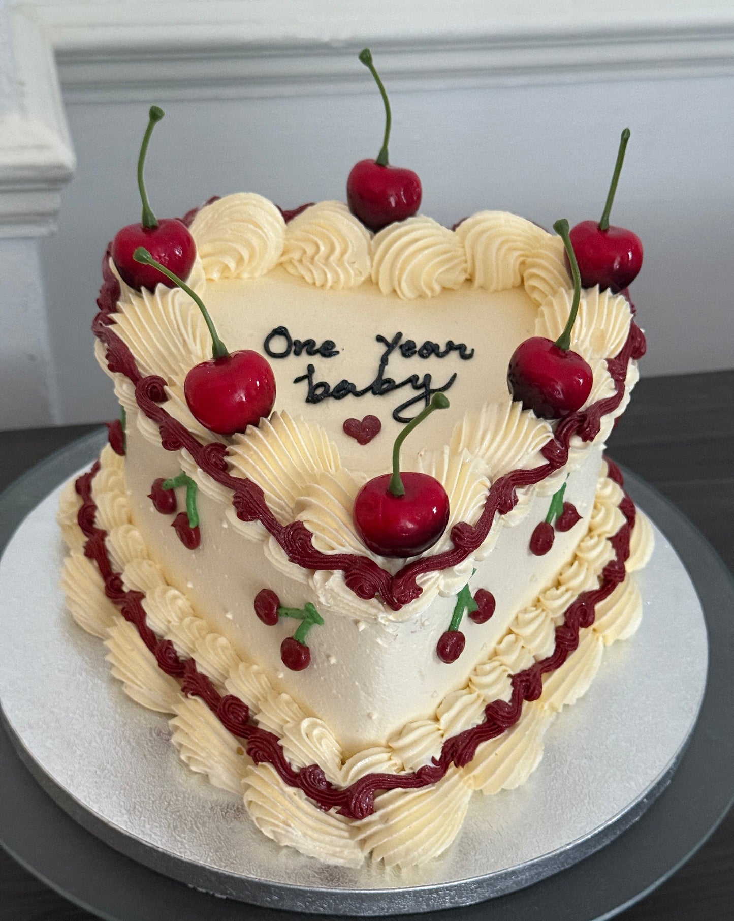 Elegant vintage-style cherry heart cake with piped buttercream swirls and fresh fruit – perfect for birthdays and anniversaries across East London from CakeTrays.co.uk.