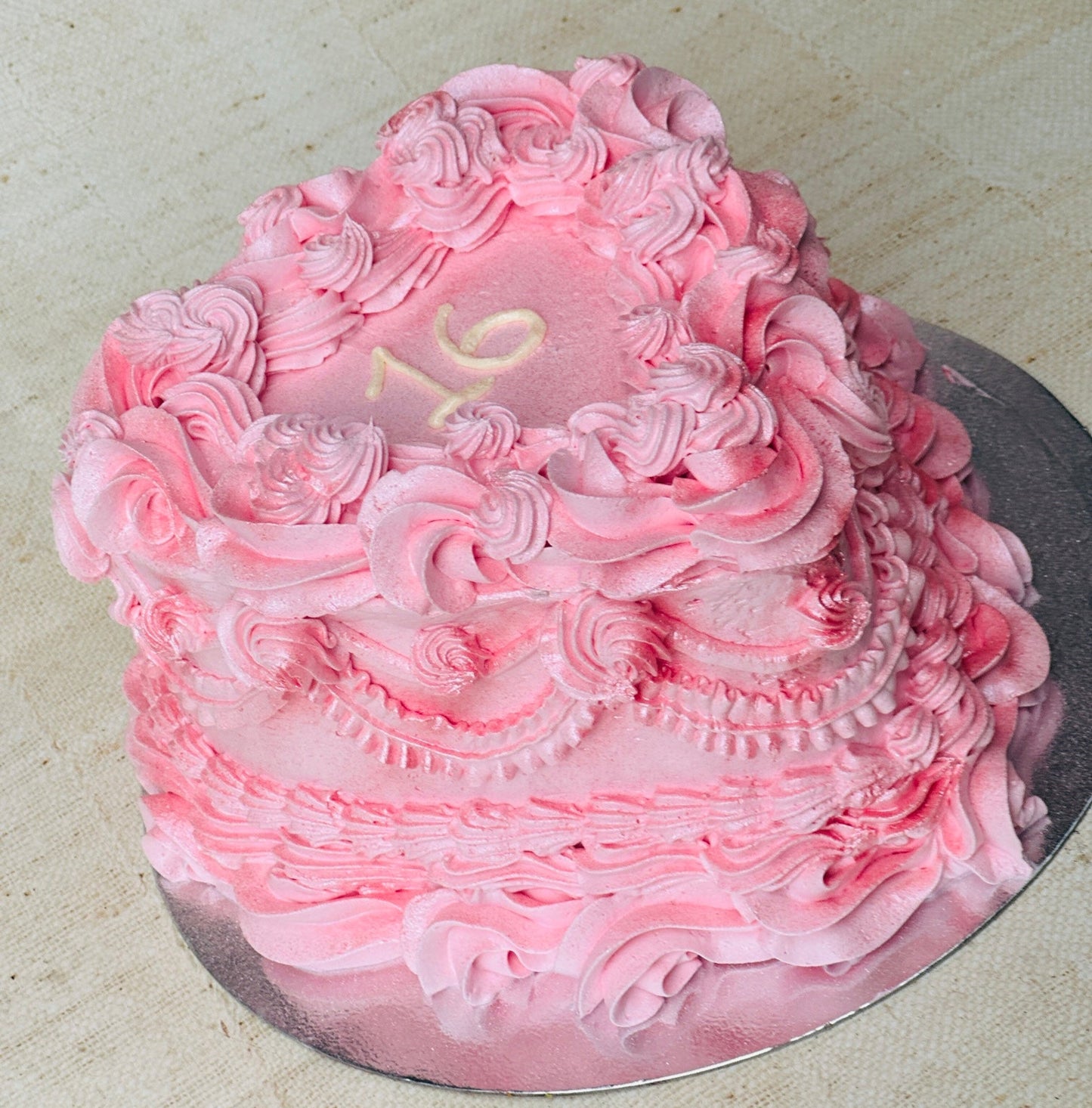 Custom sweet 16 heart birthday cake with vintage pink buttercream swirls, available in Chigwell and Hainault.