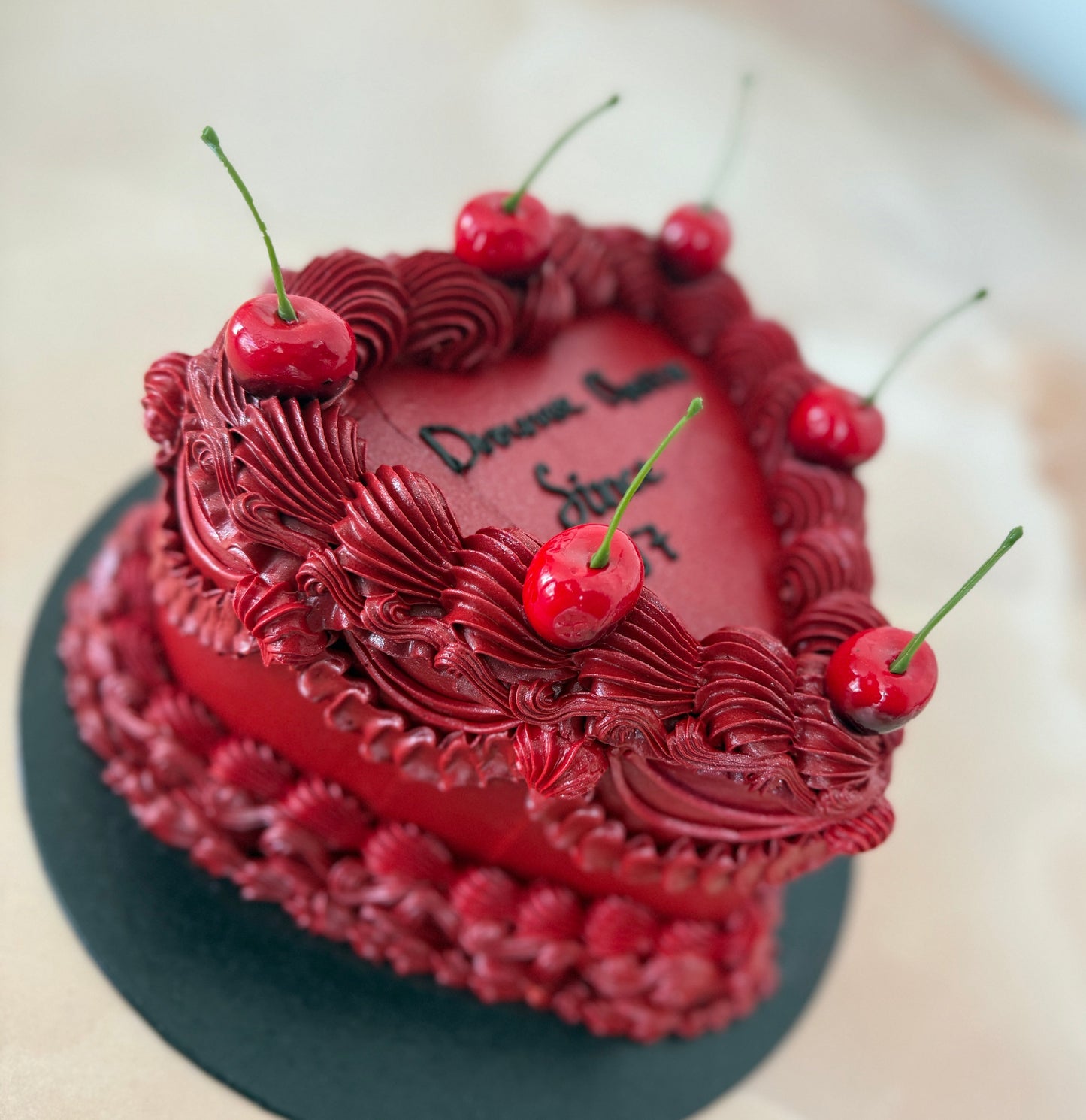 Romantic red heart cake with piped buttercream and cherries for E8 Hackney and RM10 Dagenham