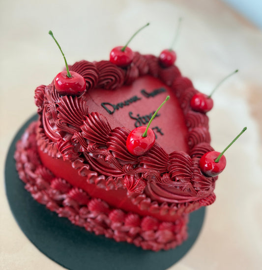 Romantic red heart cake with piped buttercream and cherries for E8 Hackney and RM10 Dagenham