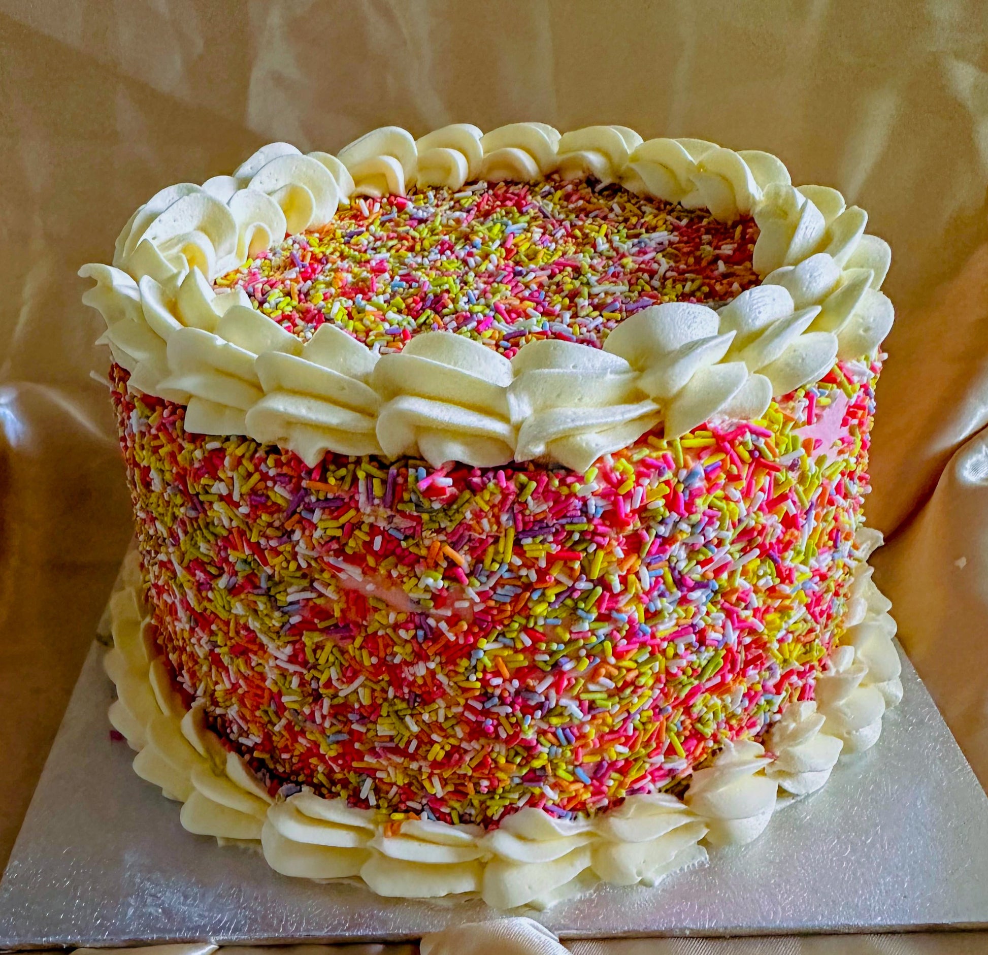 Same-day sprinkle cake delivery in Forest Gate and Manor Park – freshly baked celebration cake covered in rainbow sprinkles.
