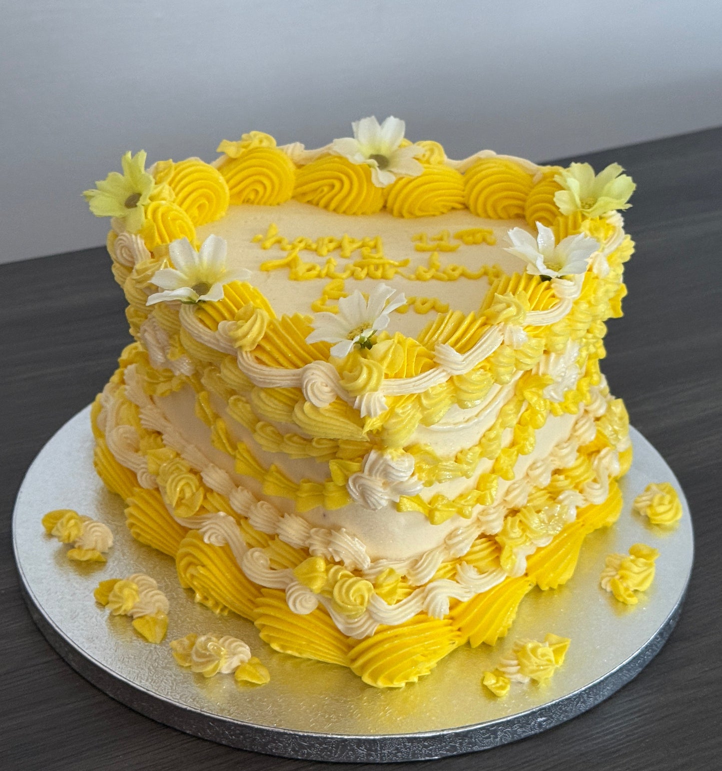 Vintage yellow heart shaped cake with floral accents and piped edges, next day delivery to Barking and Dagenham.