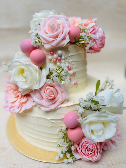 A stunning Rose Garden Wedding Cake with pink and white roses, perfect for weddings in Walthamstow.