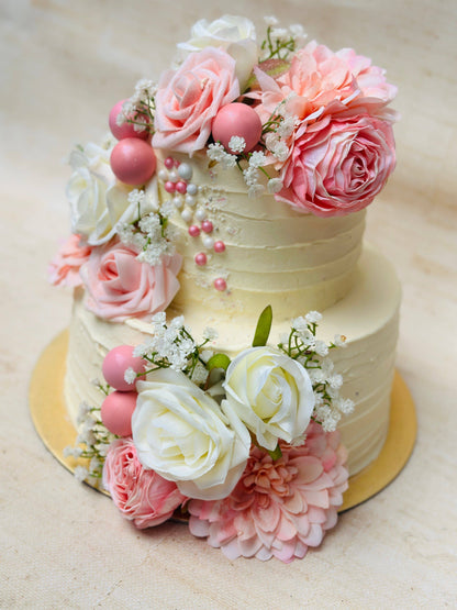 Customisable Rose Garden Wedding Cake adorned with intricate floral details and pearl accents for special occasions.
