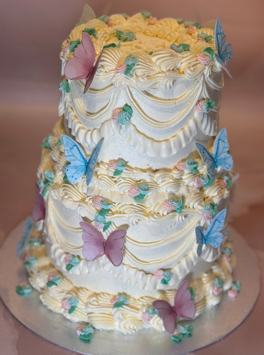 Romford delivery cake with vintage piping and soft pink and green decorations