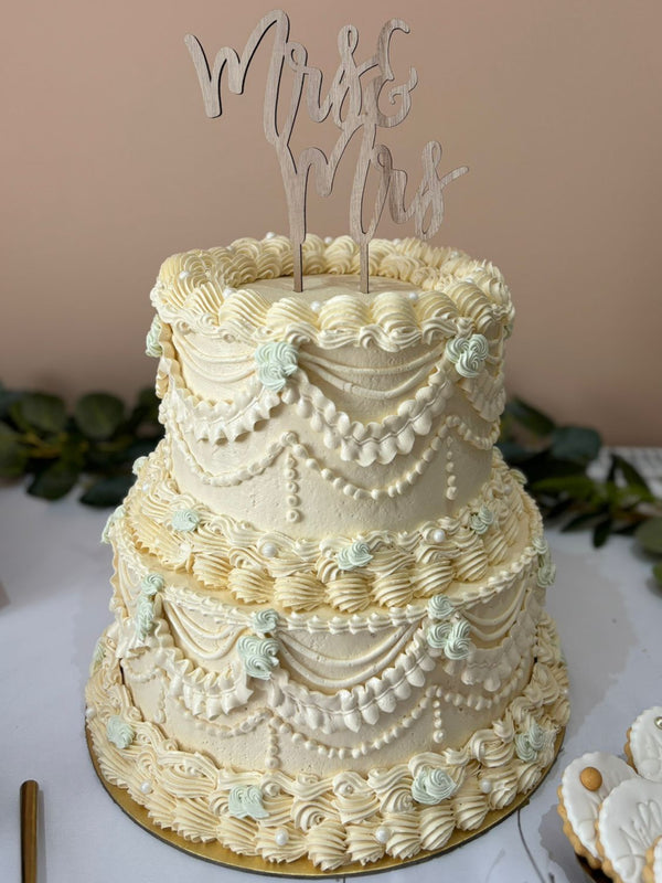 Vintage two-tier wedding cake delivered to an Ilford reception venue