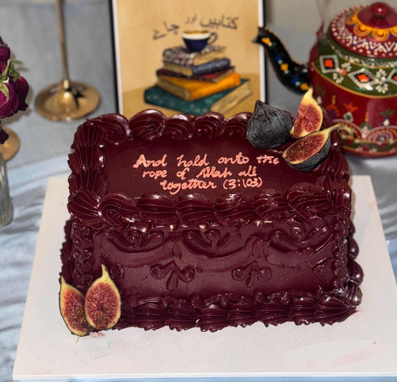 Deep burgundy vintage sheet cake with hand piped rosette borders and a Quranic verse, made in East London by Cake Trays.