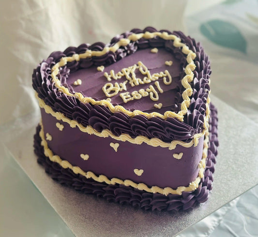 Best heart-shaped birthday cake with mini hearts and purple frosting, perfect for birthdays in Forest Gate and Barking.