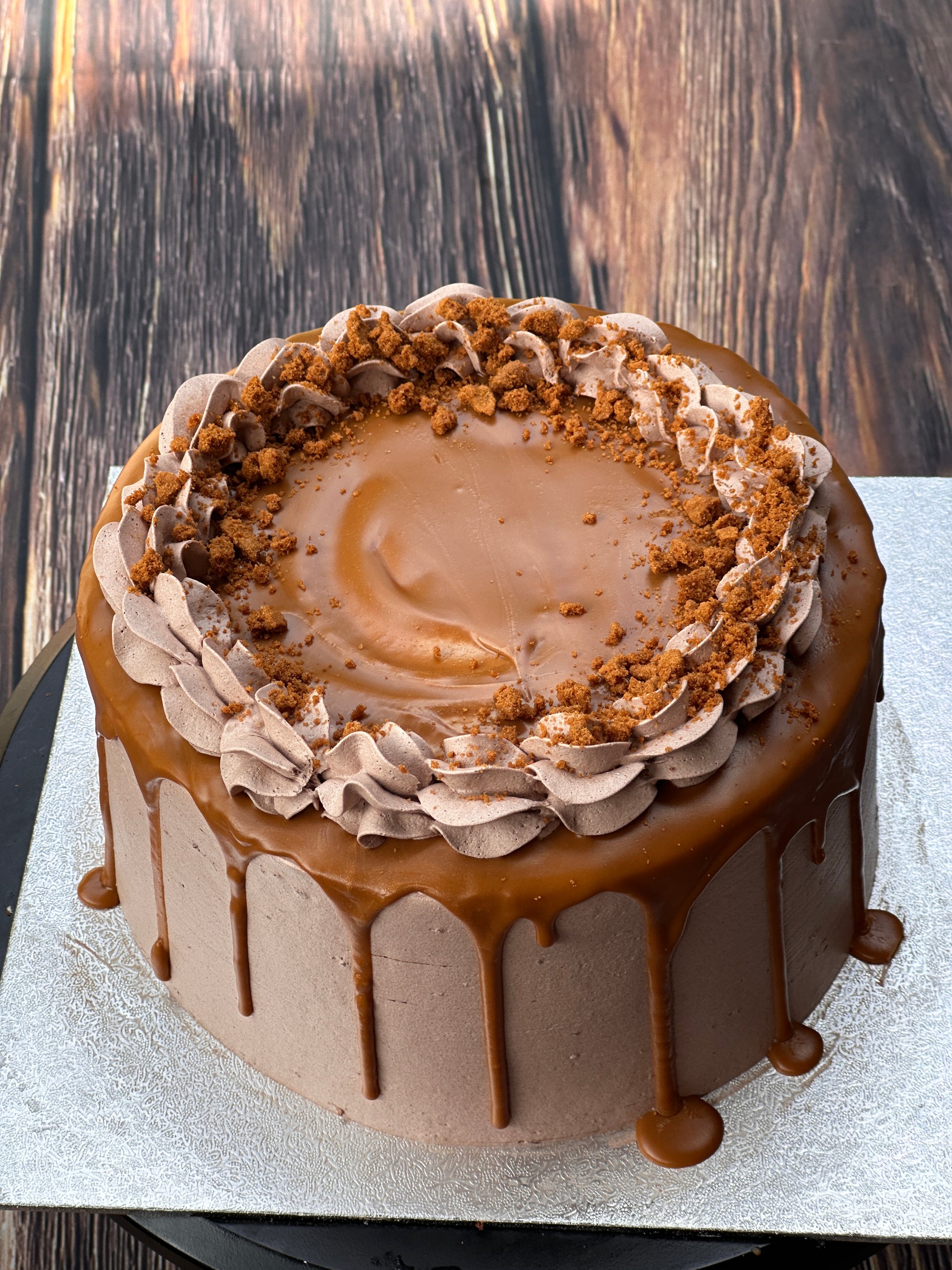 Buttercream drip cake with chocolate decorations, delivery to Chigwell and Woodford.
