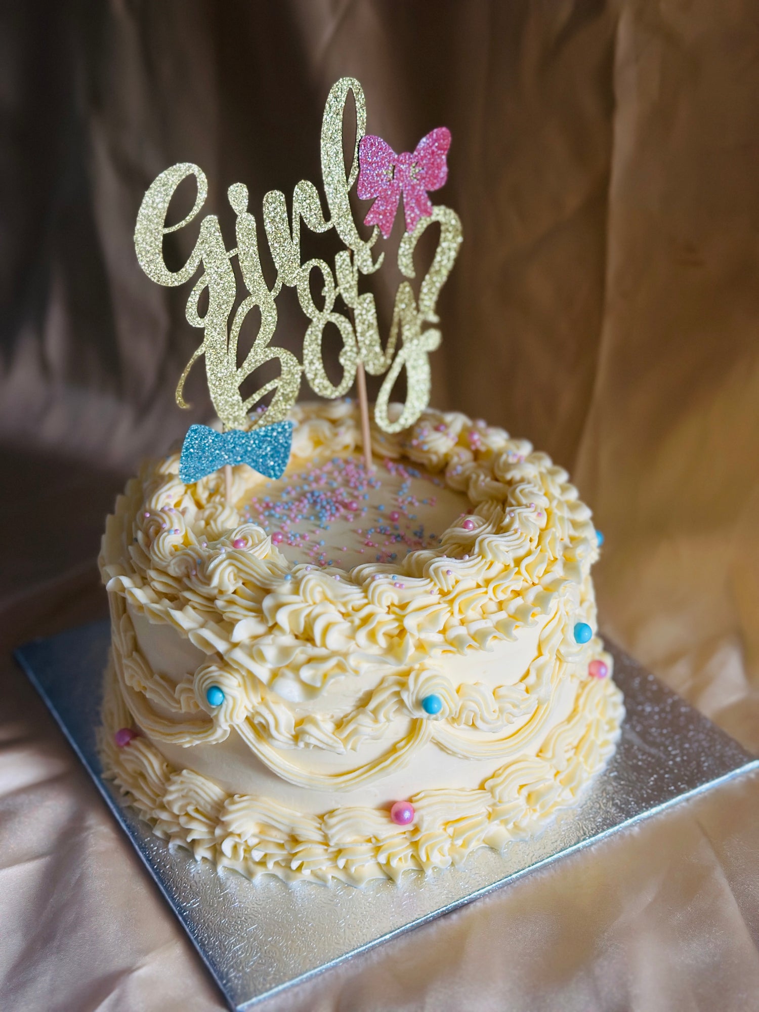 Custom buttercream gender reveal cake for baby shower in East London