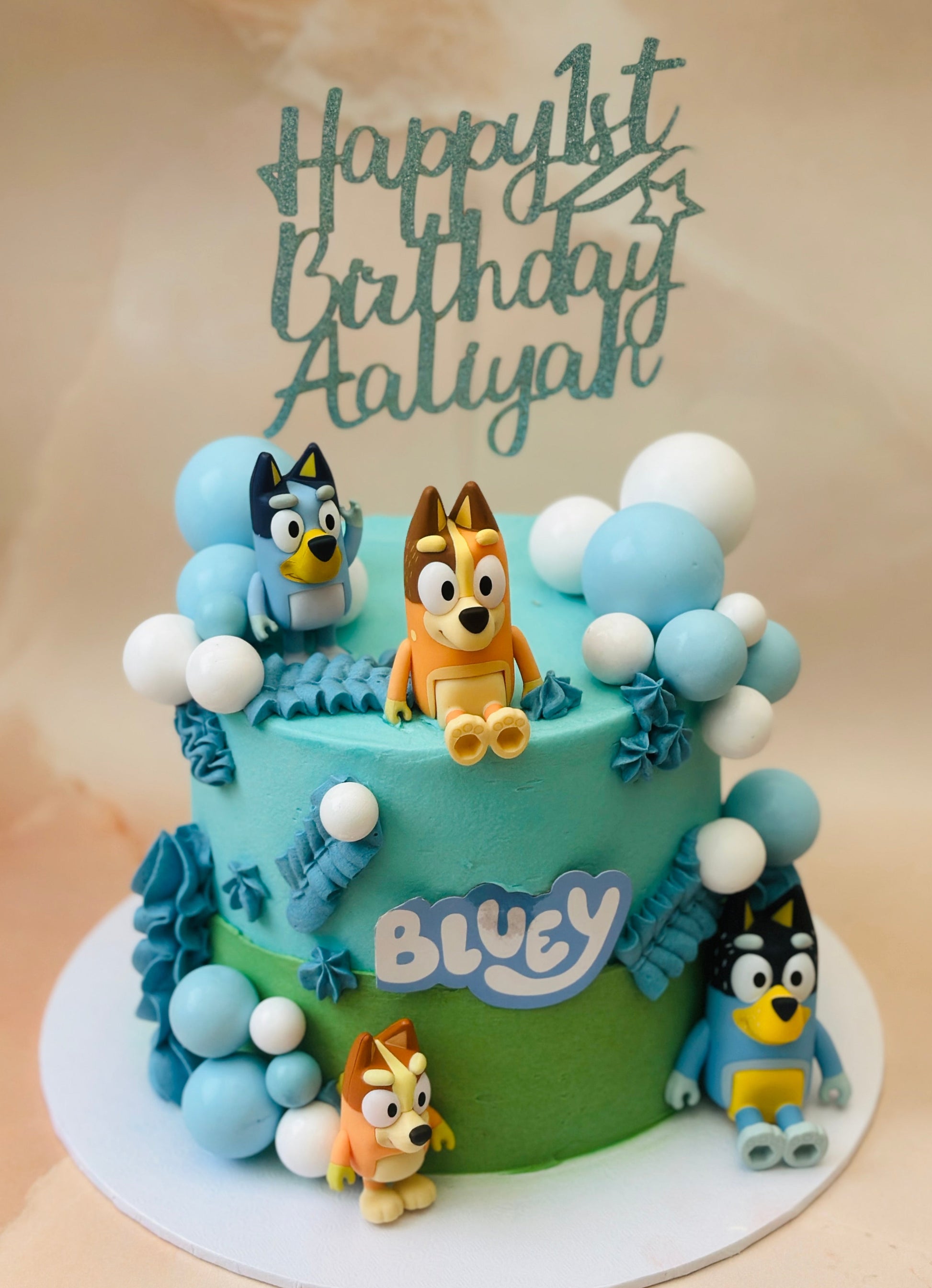 Buy Bluey birthday cake in Romford and Ilford – custom children’s cake with Bluey characters and decorations.