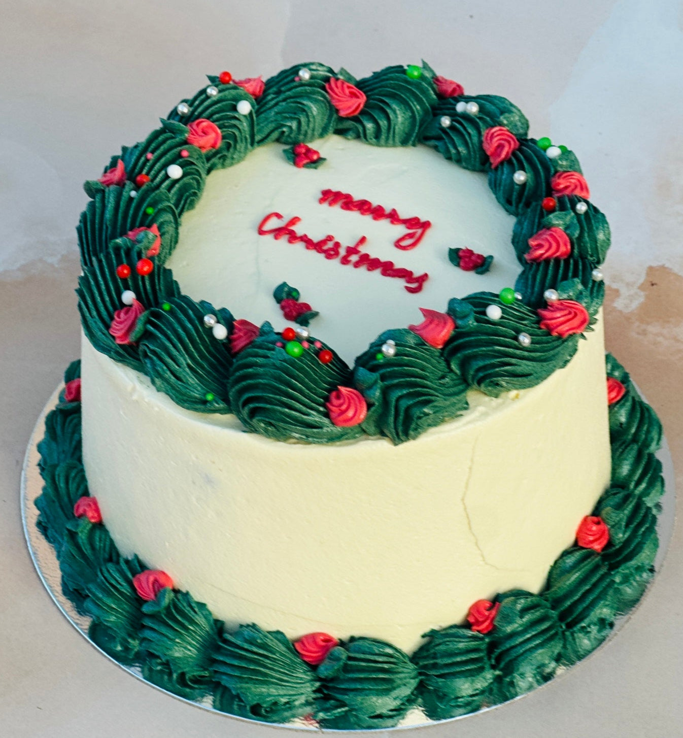 Buy Christmas cake in Romford and Ilford with same-day delivery – freshly baked festive buttercream cake.