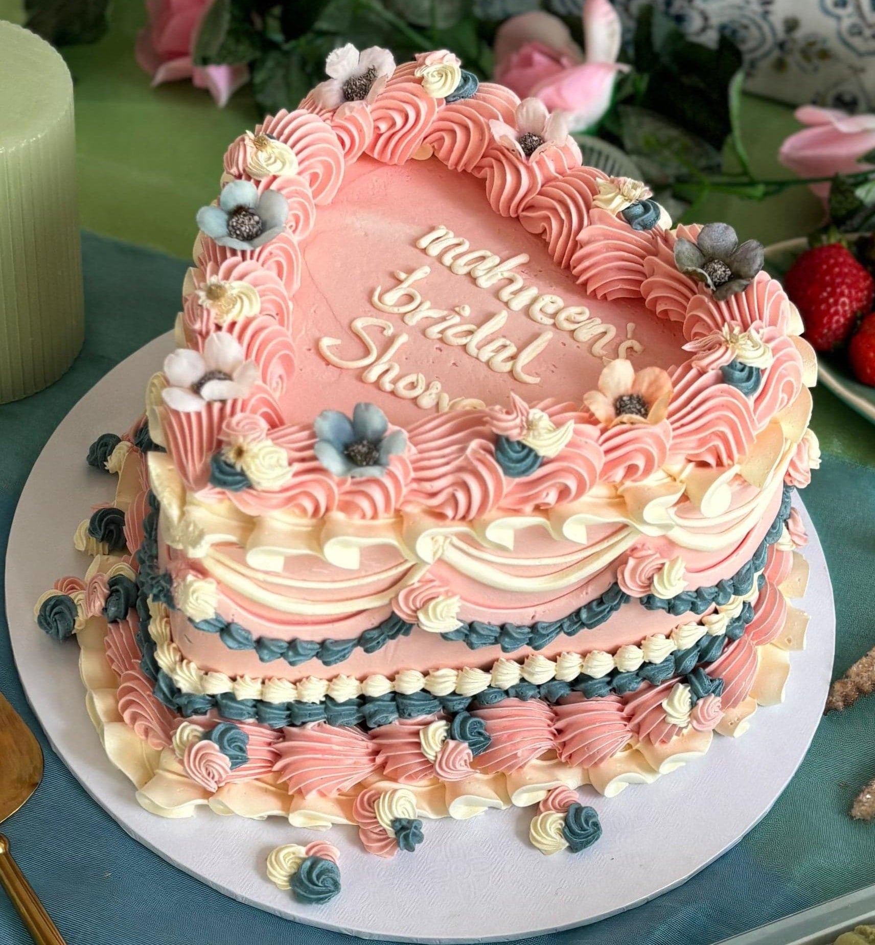 Buy floral heart cake for bridal showers in Ilford and Leytonstone – decorated with pastel piping and sugar flowers.