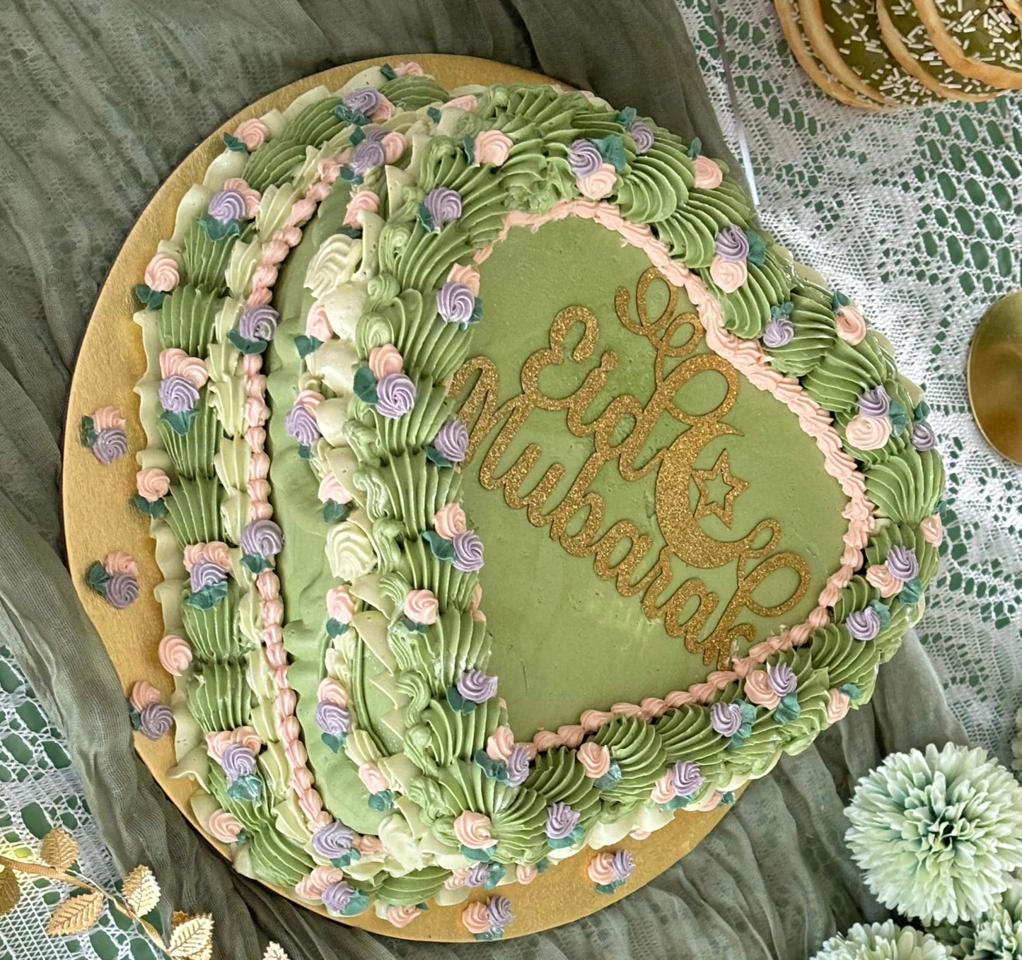 Buy pastel green heart cake decorated with floral piping in Walthamstow and Barking – perfect for birthdays or special occasions.