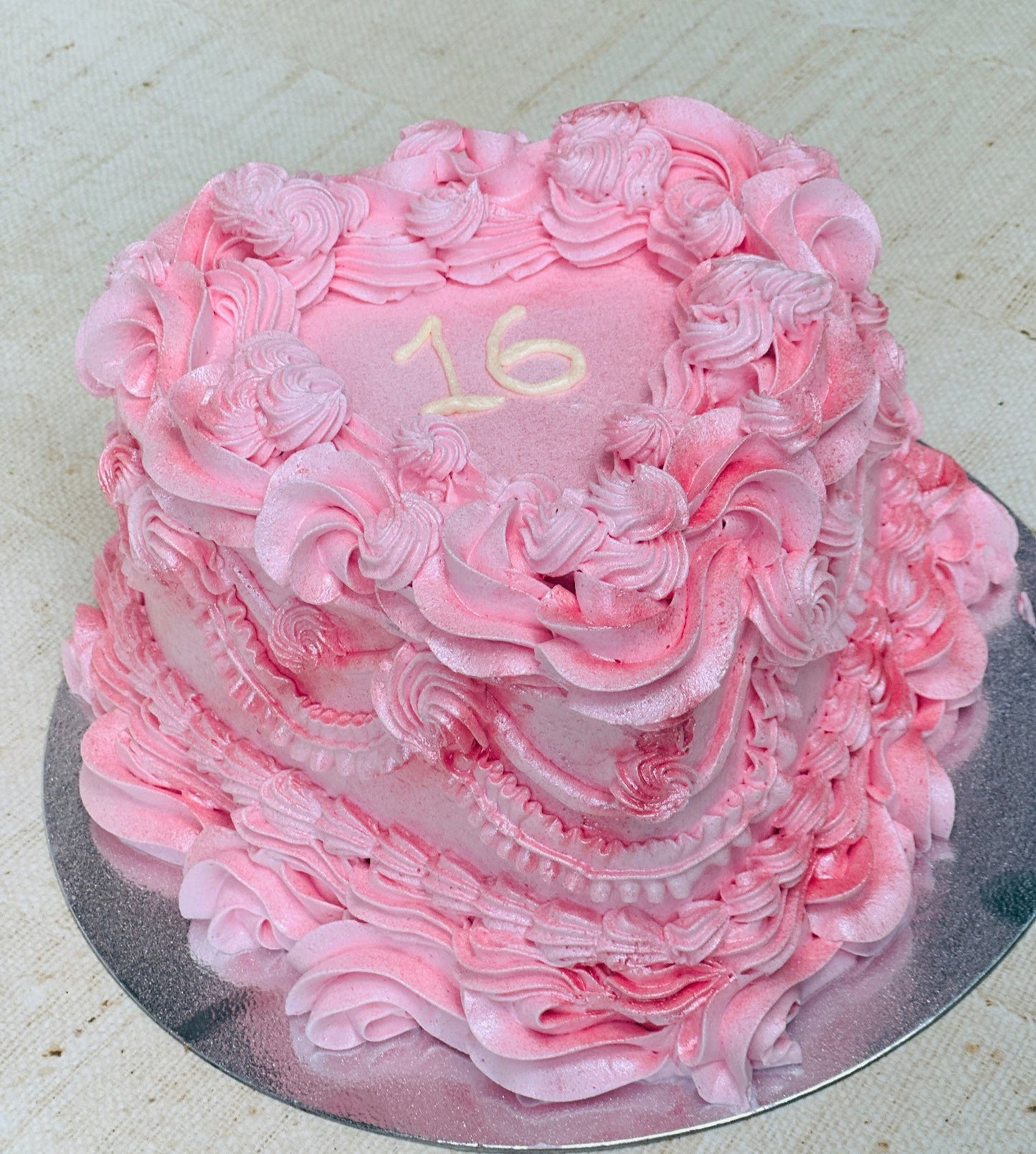 Buy sweet sixteen heart cake in Romford and Ilford – pink vintage buttercream design perfect for milestone birthdays.