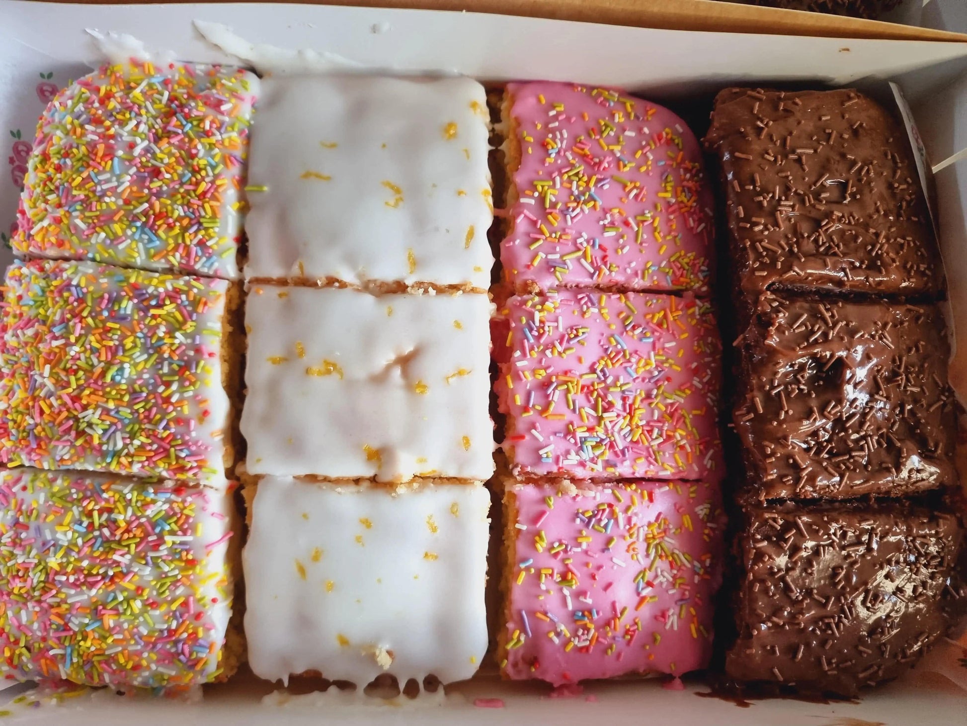Mixed selection of 12 neatly packed cake slices ready for next-day delivery to East Ham and Walthamstow.