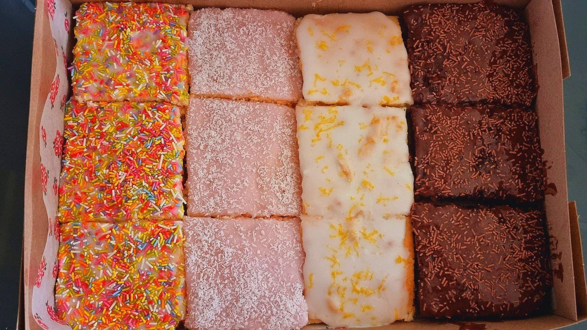 Rows of cake slices in a gift box, perfect for gifting and events in Stratford and Chigwell, East London.