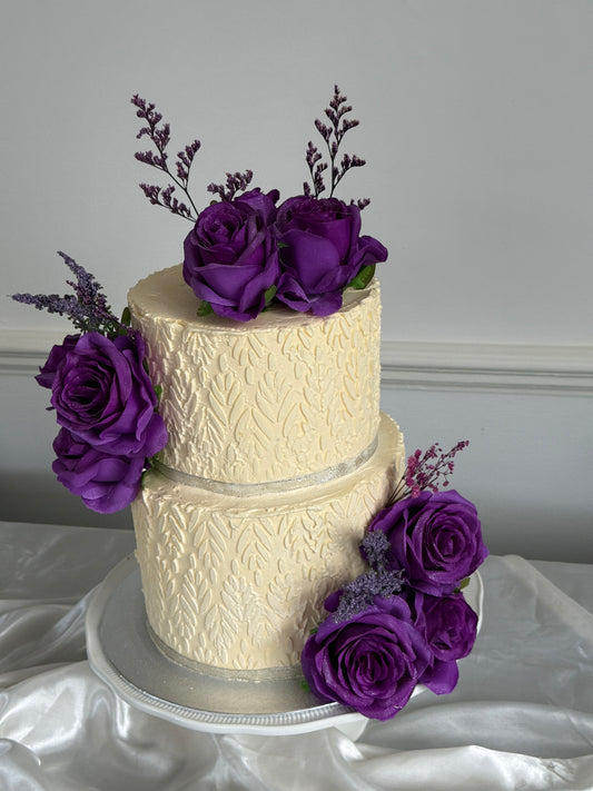 Front view of the Amethyst Rose Embossed Two-Tier Wedding Cake with purple roses and silver trim, perfect for weddings and nikkahs in Ilford IG1, Goodmayes and Seven Kings.