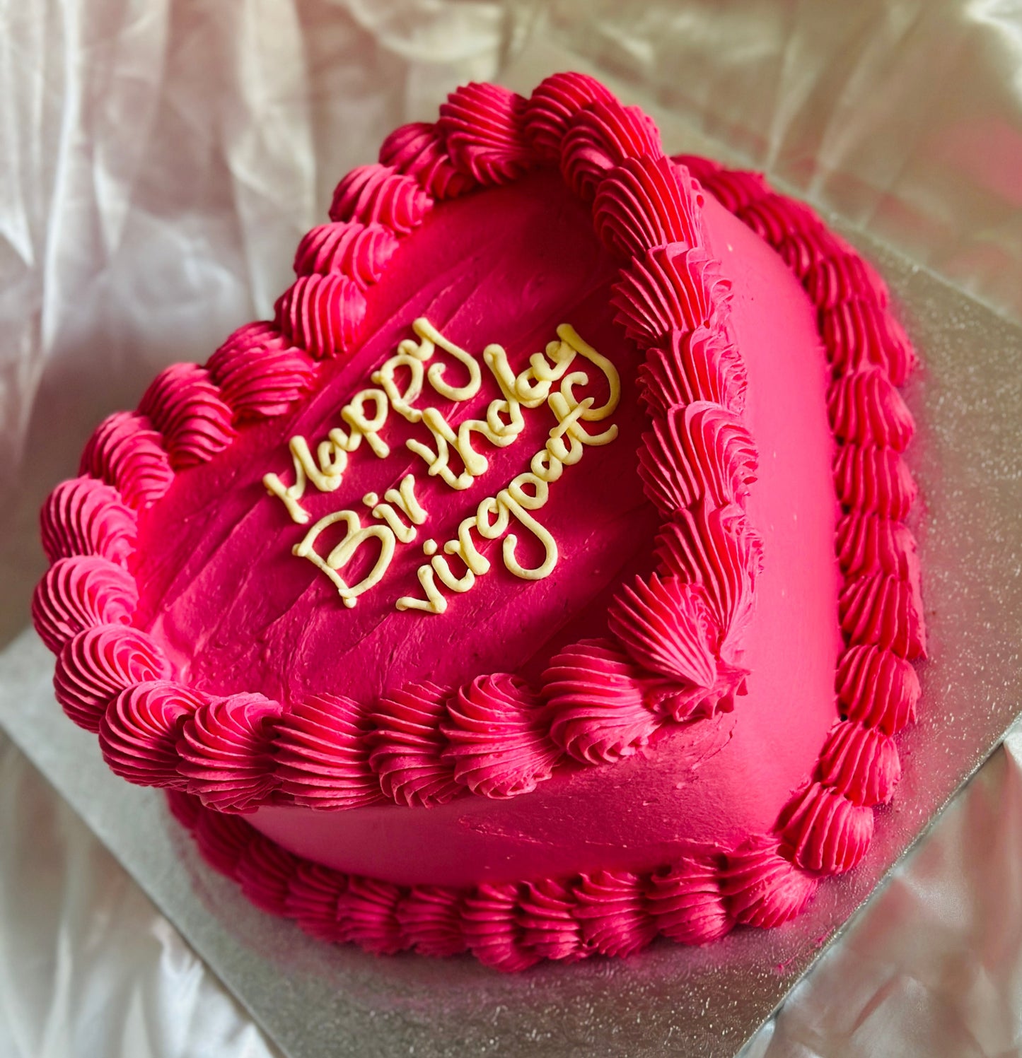 Custom heart cake with floral buttercream piping, available in East Ham and Woodford for birthdays and special occasions.