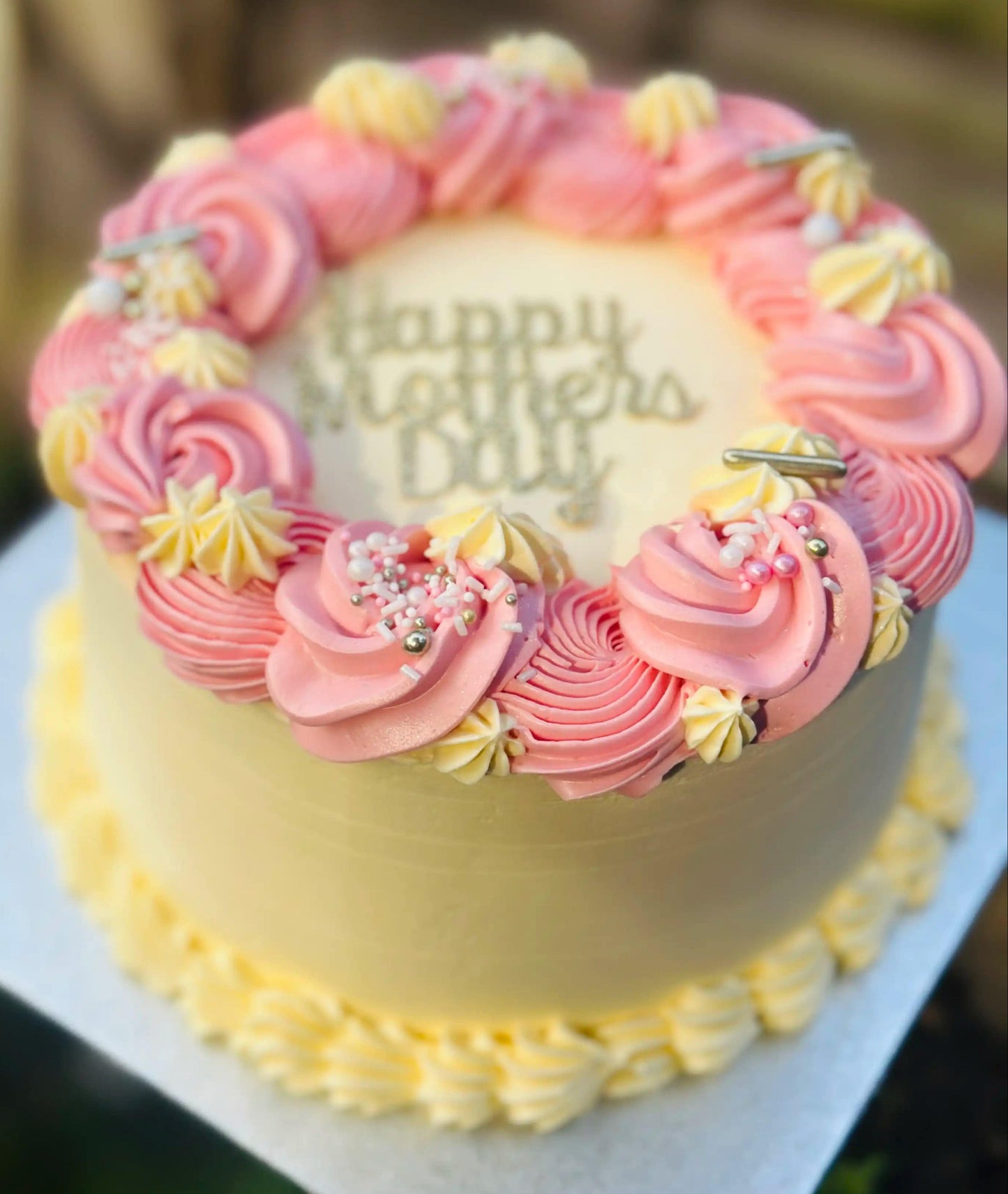 Custom Mother’s Day cake with piped floral buttercream, freshly baked for delivery in Walthamstow and Barking.