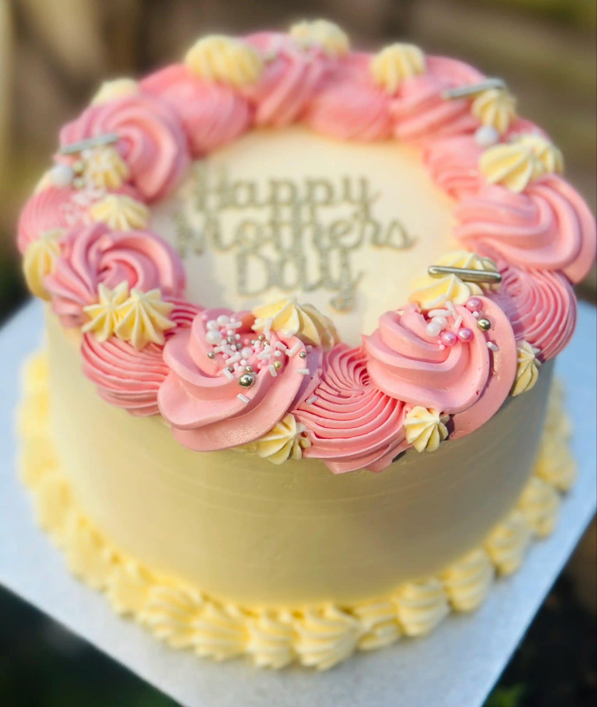 Custom Mother’s Day cake with piped floral buttercream, freshly baked for delivery in Walthamstow and Barking.