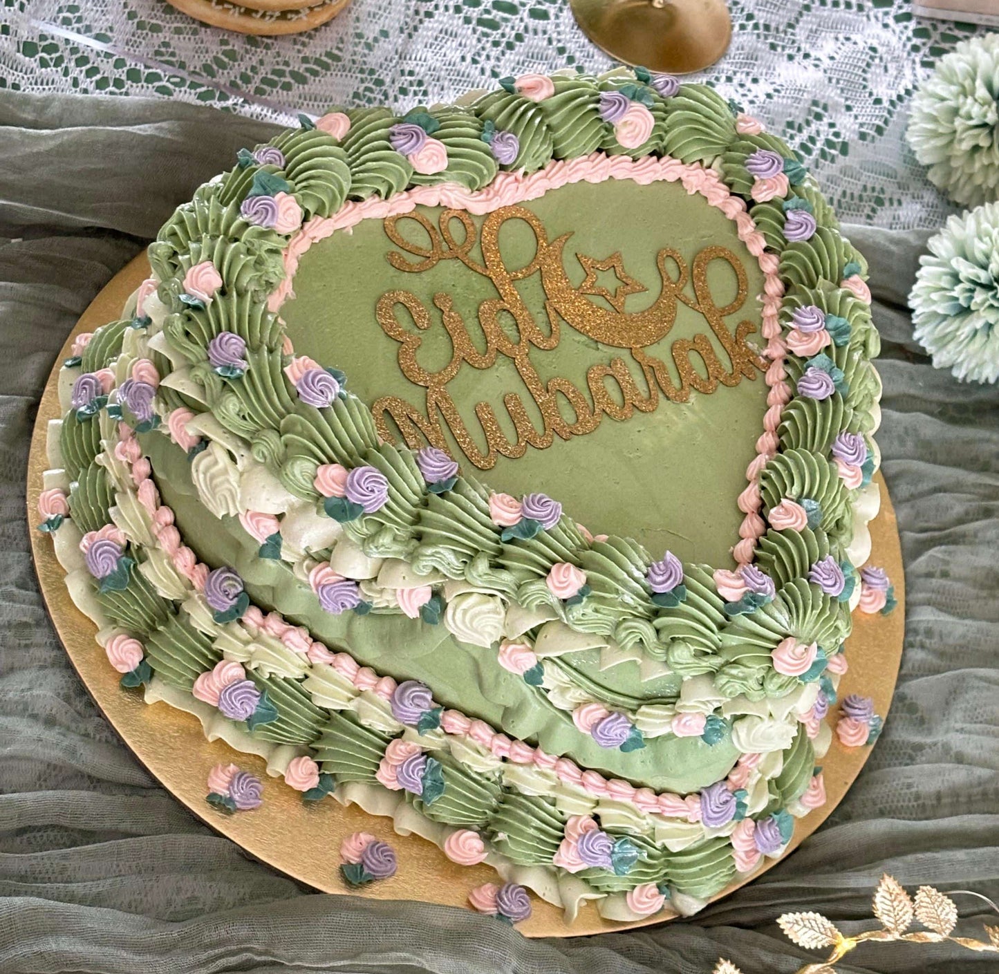 Custom pastel green floral birthday cake with vintage design, available in Chigwell and East Ham.