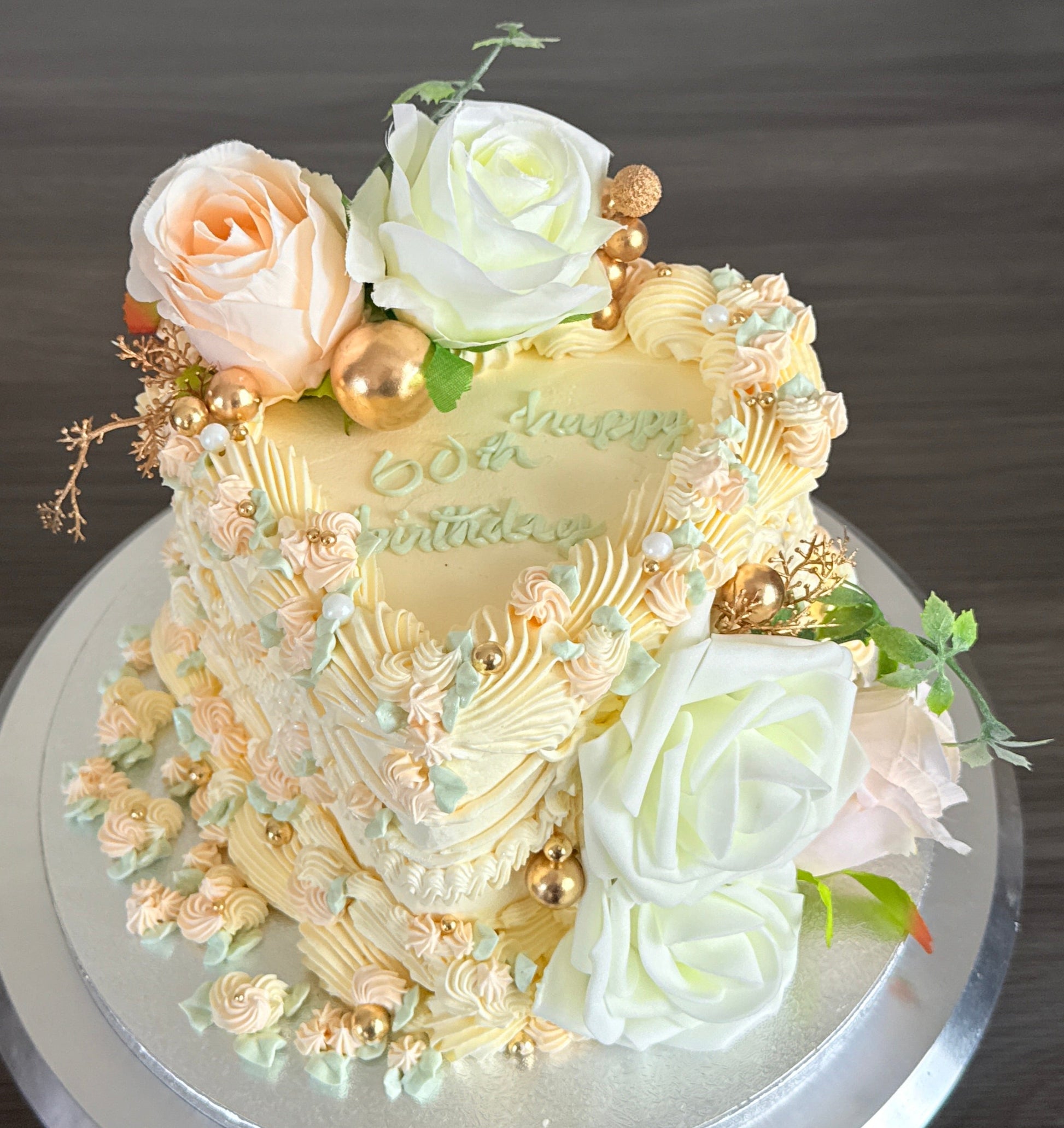 Luxury floral buttercream heart cake with roses available in Barking and Dagenham