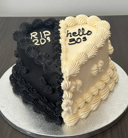 Black and white milestone birthday cake with buttercream piping in East London