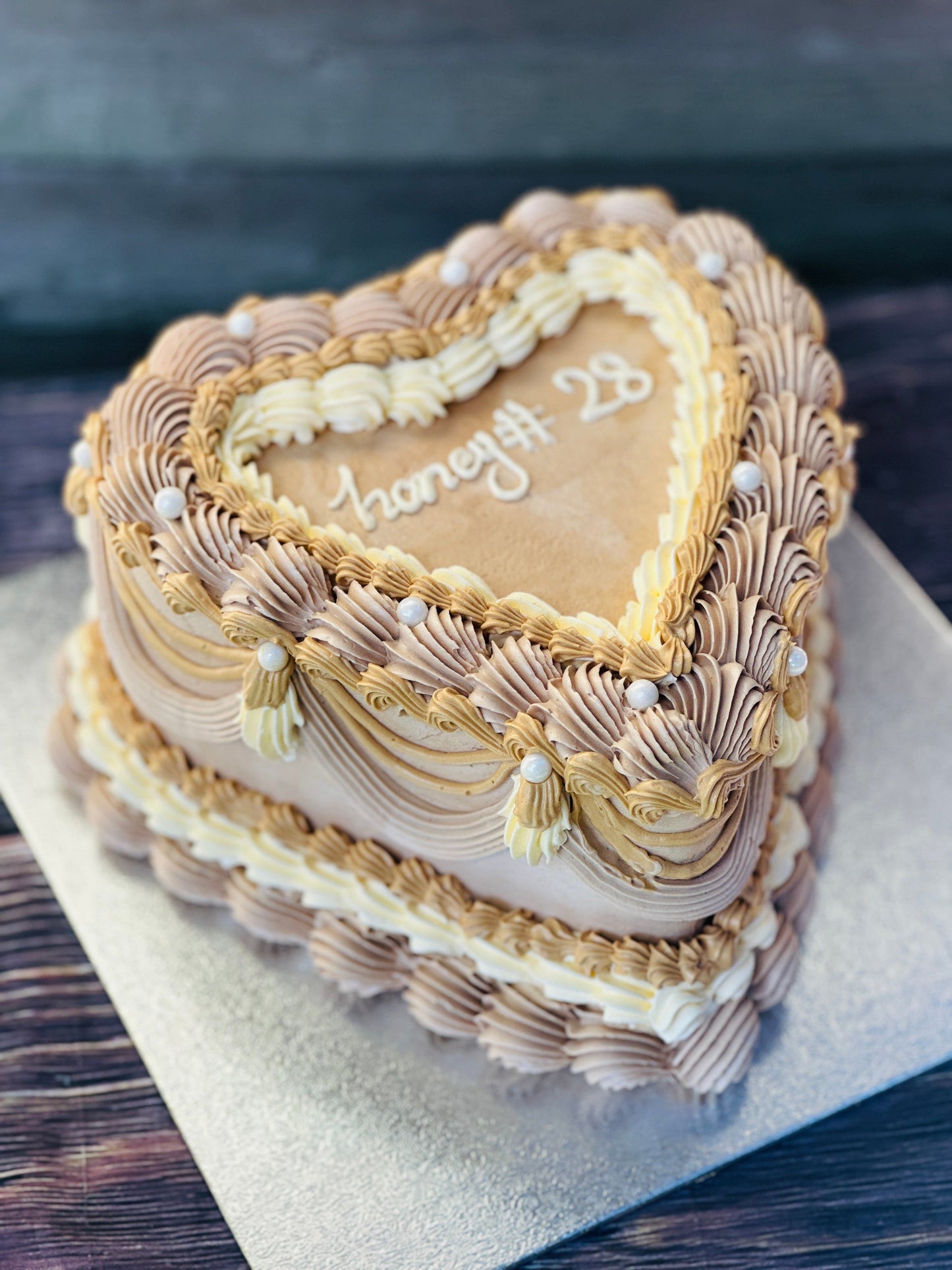 Heart-shaped cake with delicate piping and buttercream design, available for delivery in Walthamstow.