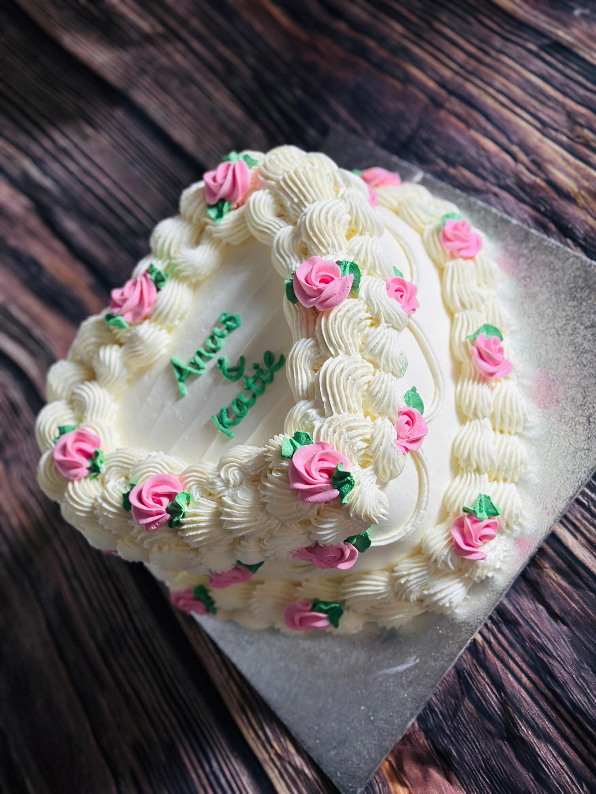 Heart-shaped Vintage Cake CT50 with intricate white piping and pink flowers, delivered in Barking.