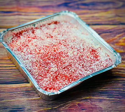 Jam and coconut tray bake with vanilla sponge, strawberry jam and desiccated coconut, available for delivery in Romford and Ilford, East London.