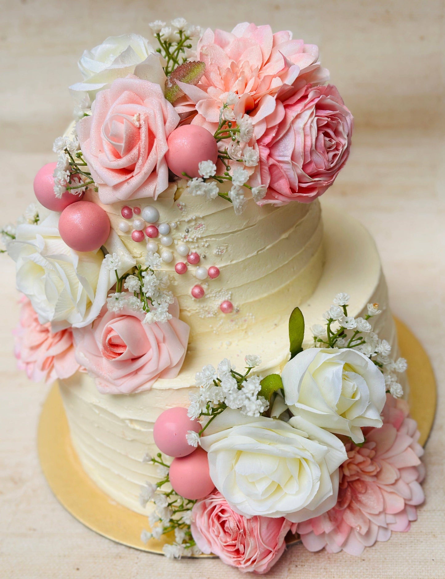 Luxury rose wedding cake with pearl details and floral decorations, handmade for couples in Dagenham and East London.