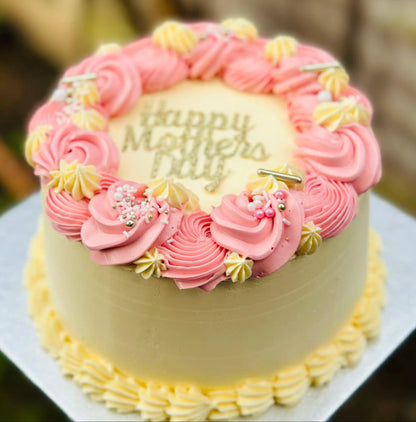 Mother’s Day cake with pink buttercream swirls and sprinkles, available for delivery in Romford and East Ham.