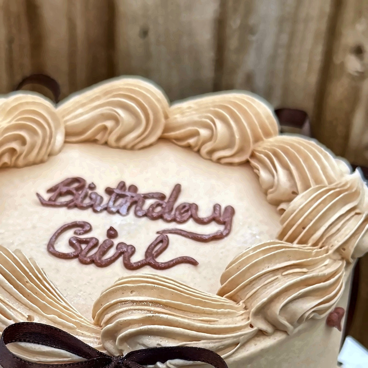 Nude Vintage Bow Cake piped Birthday Girl message close-up