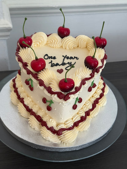 Elegant vintage-style cherry heart cake with piped buttercream swirls and fresh fruit – perfect for birthdays and anniversaries across East London from CakeTrays.co.uk.