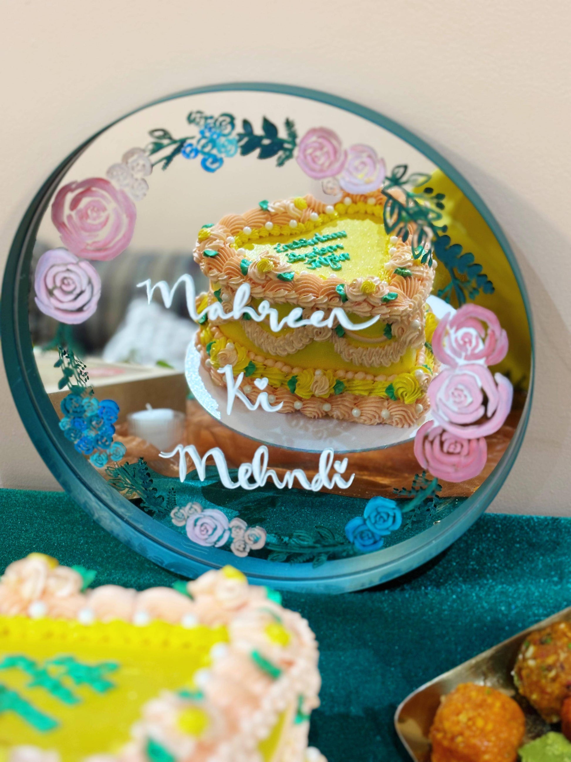 Order dholki heart-shaped cake with traditional colourful piping, available in Forest Gate and South Woodford.