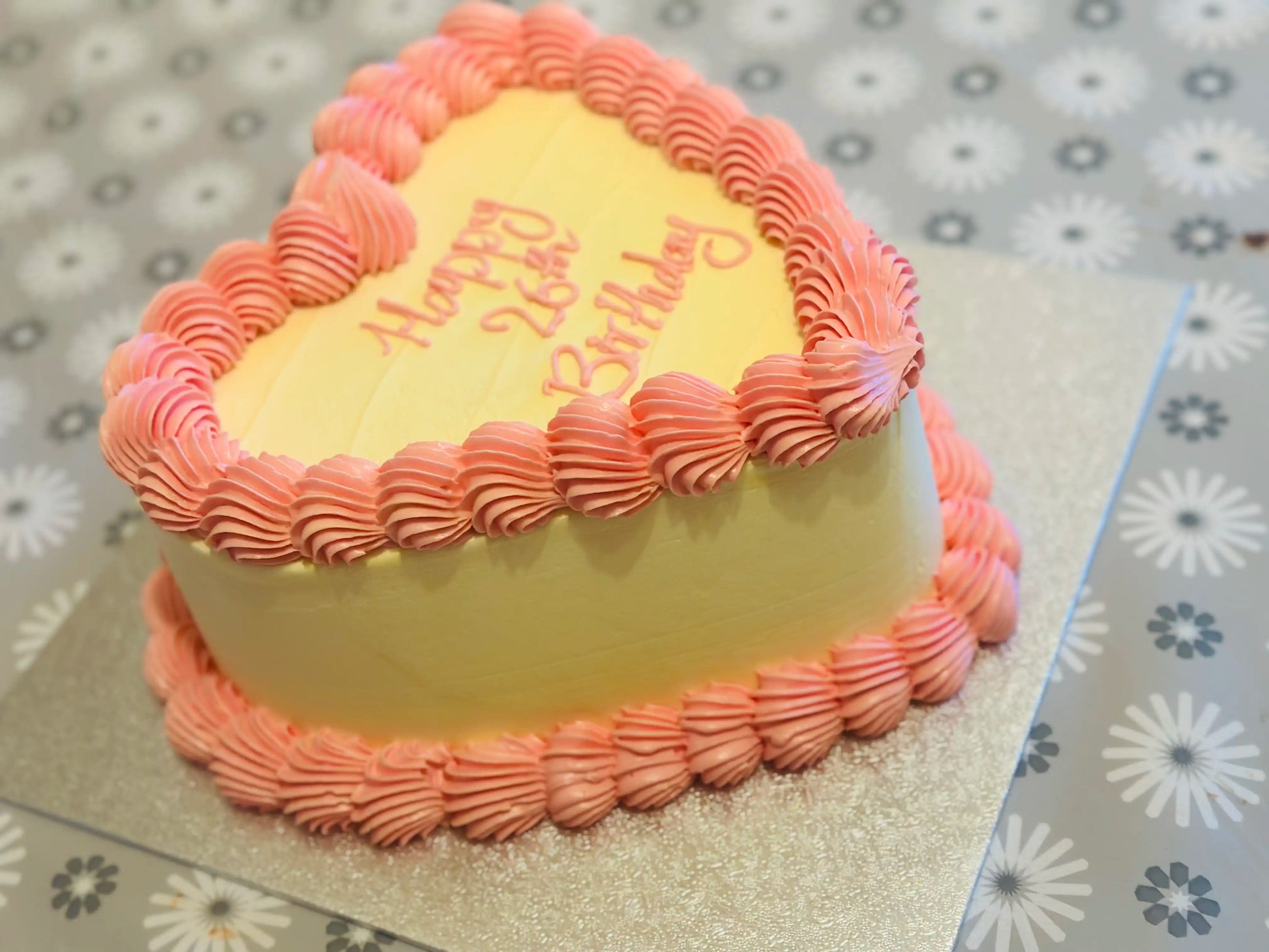 Heart cake with elegant gold leaf detailing, perfect for engagements and weddings, from CakeTrays.co.uk.
