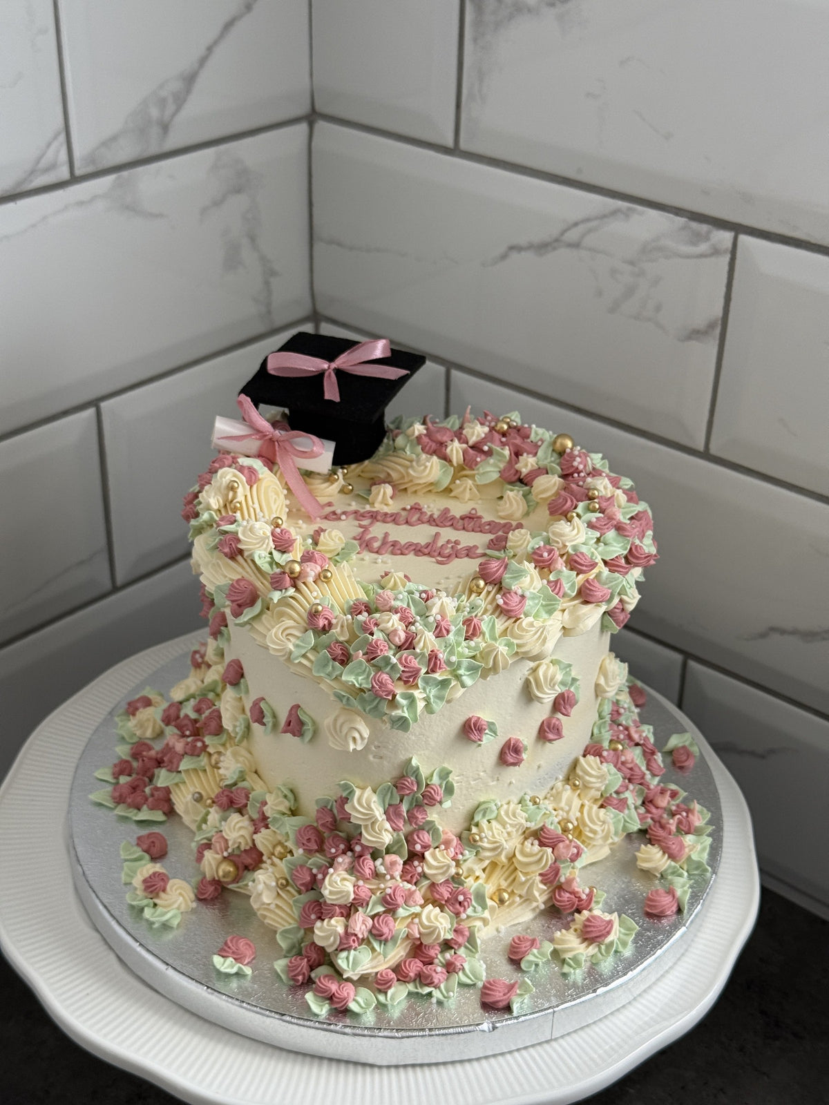 Front view of the pastel graduation heart cake covered in rosettes, custom cakes East London, Romford and Ilford.