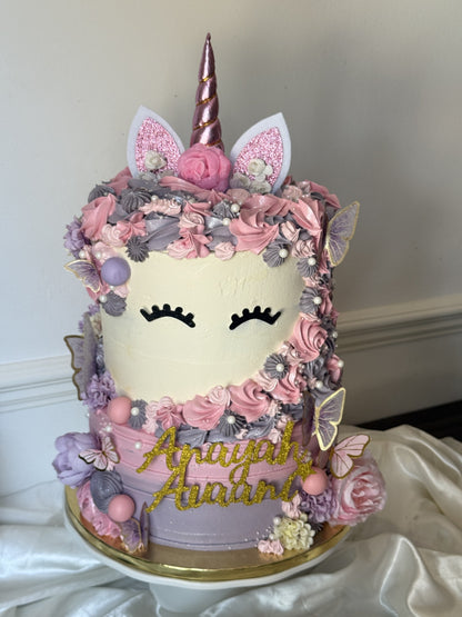 Side view of the unicorn cake showing the rosette mane and butterflies, custom cakes East London, Romford and Ilford.