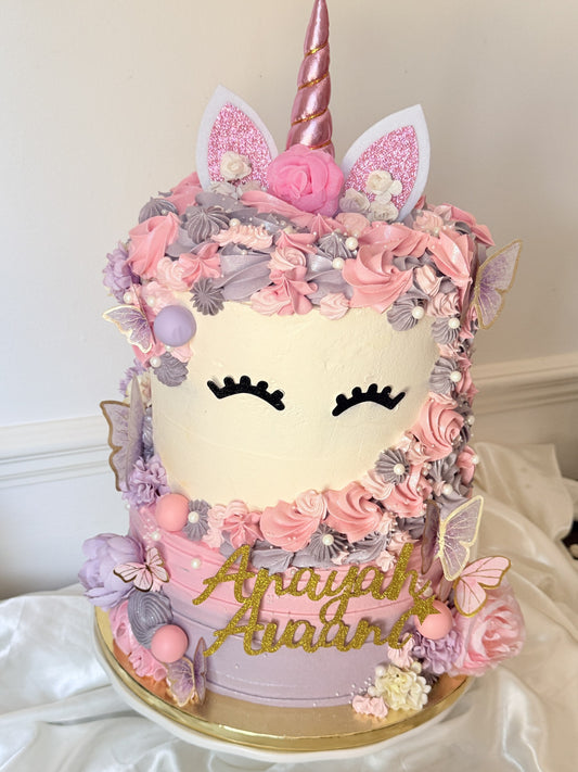 Extra tall pink and lilac unicorn birthday cake with rose gold horn and glitter name topper, custom cakes East London, Romford and Ilford.